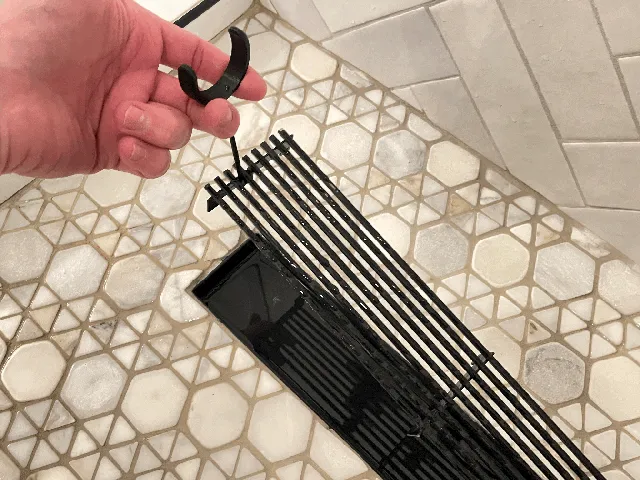 Shower grate tool