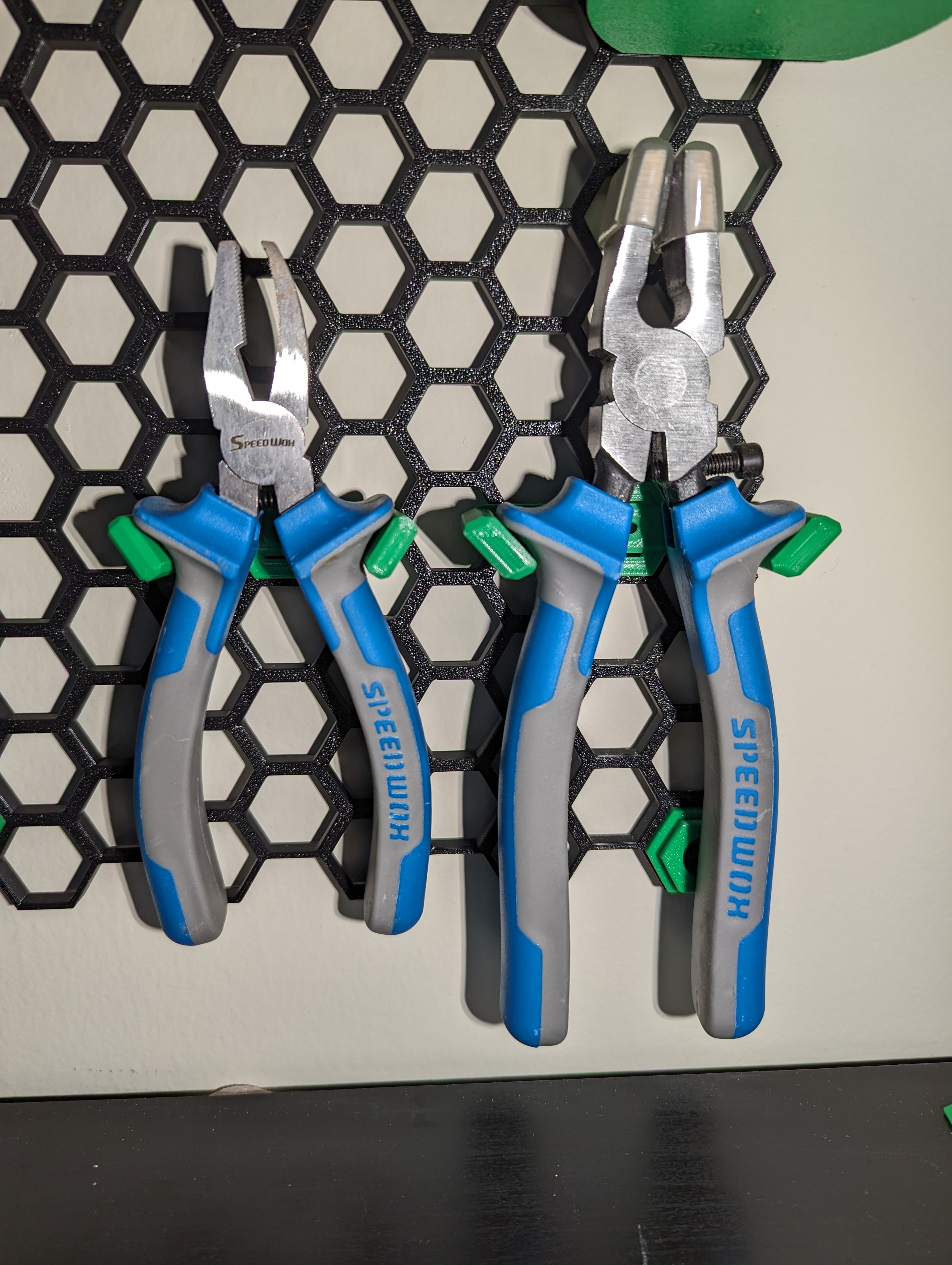 Plier holder for honeycomb storage wall