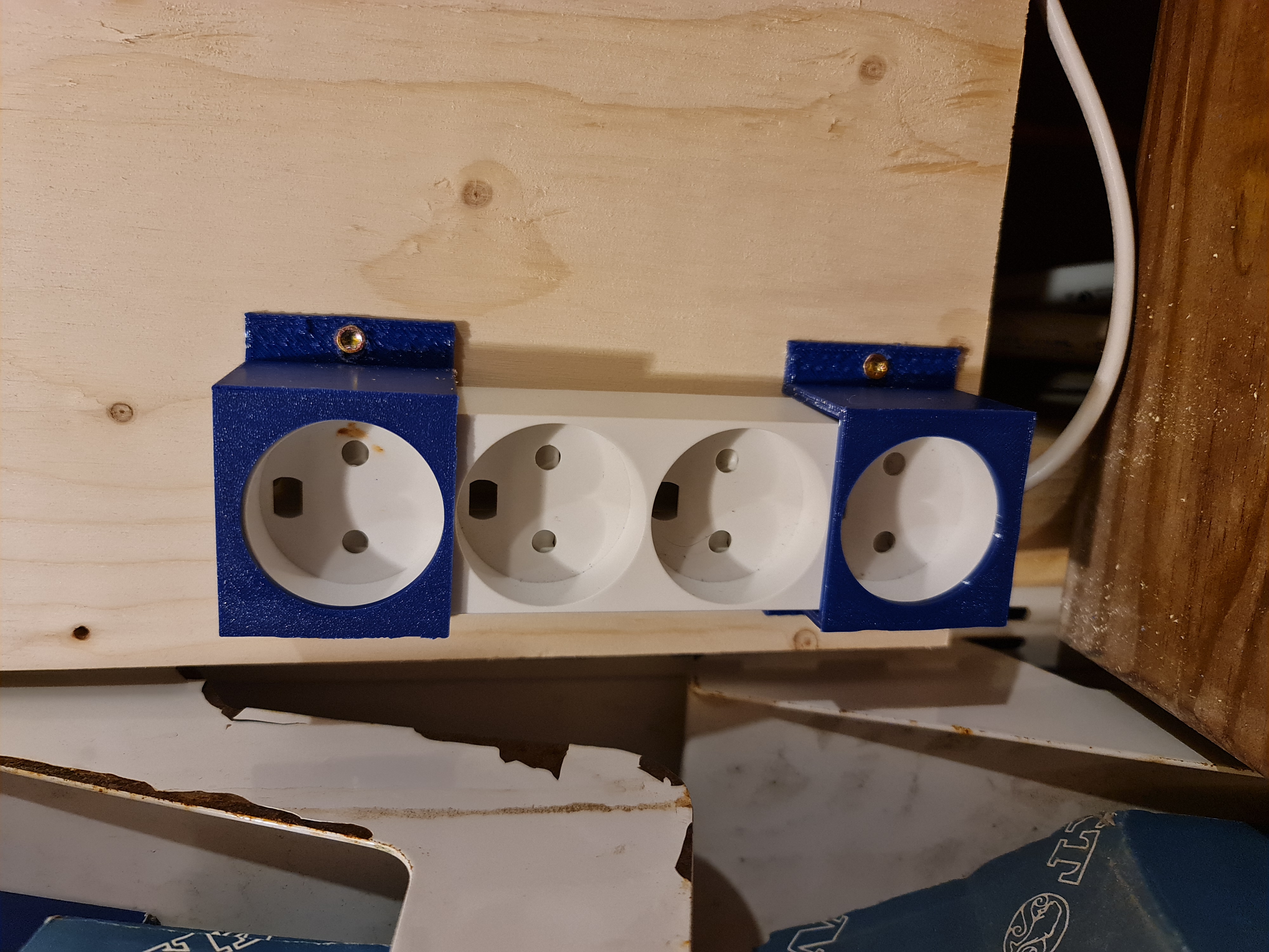 Bracket for power strips with Type-K sockets (Danish sockets)