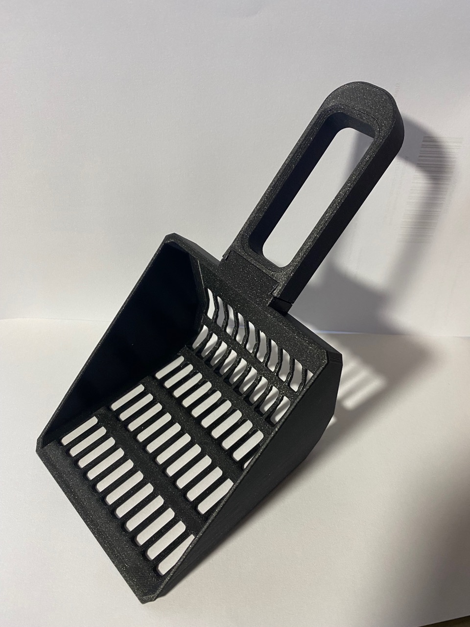 Cat litter scoop.
