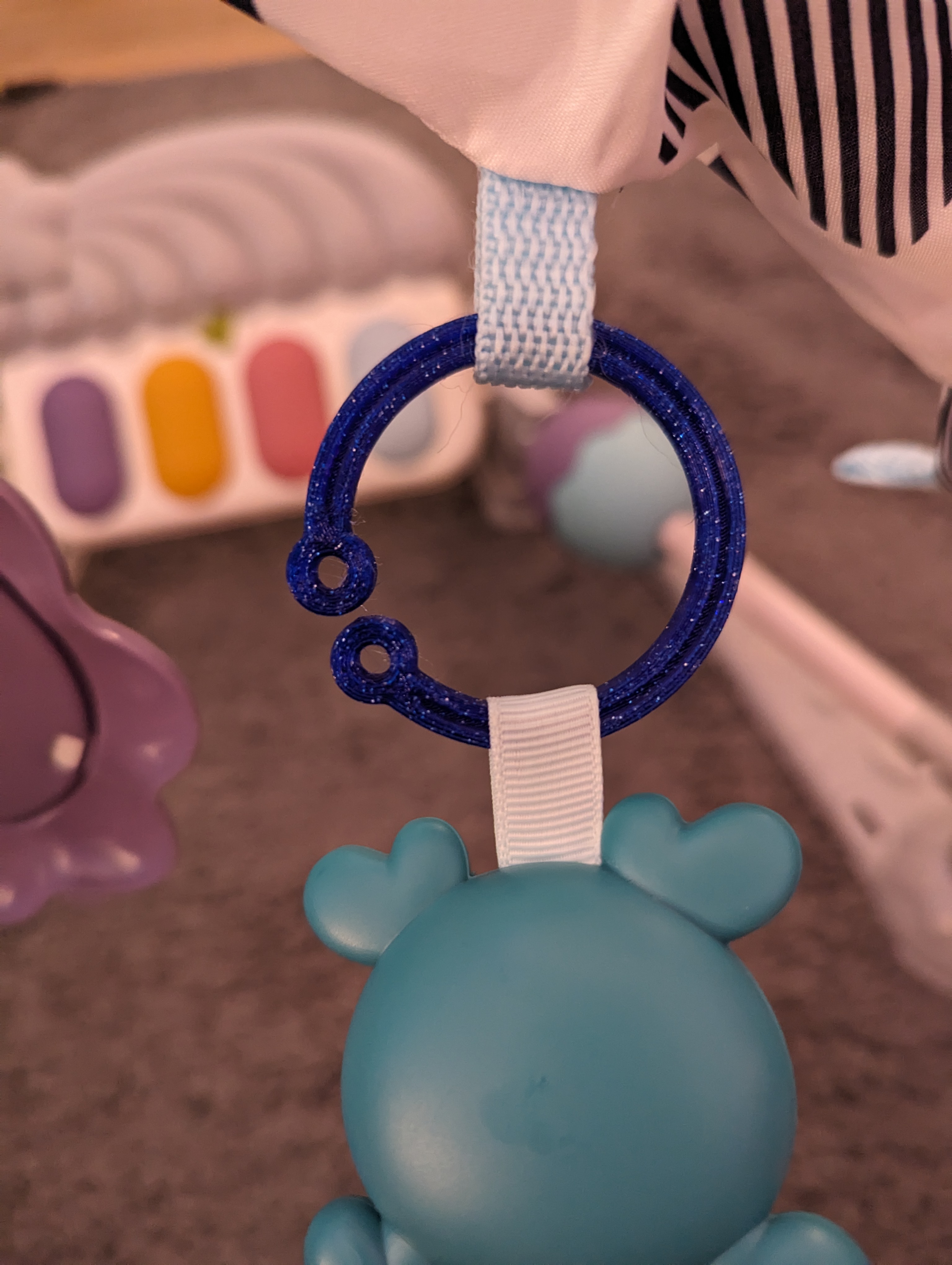 Flexible universal hook / clip hanger for baby toys
