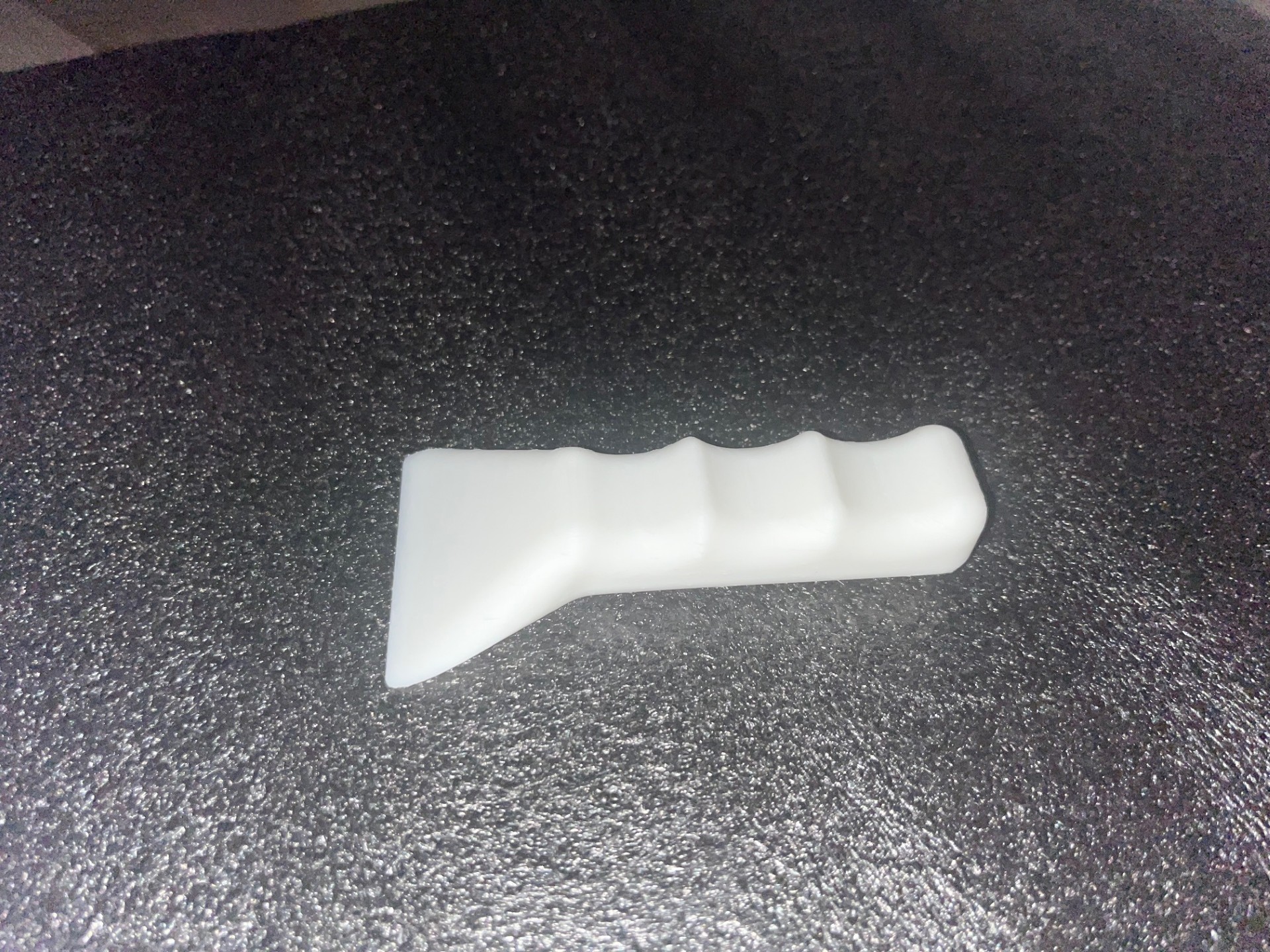 Ergonomic bed scraper