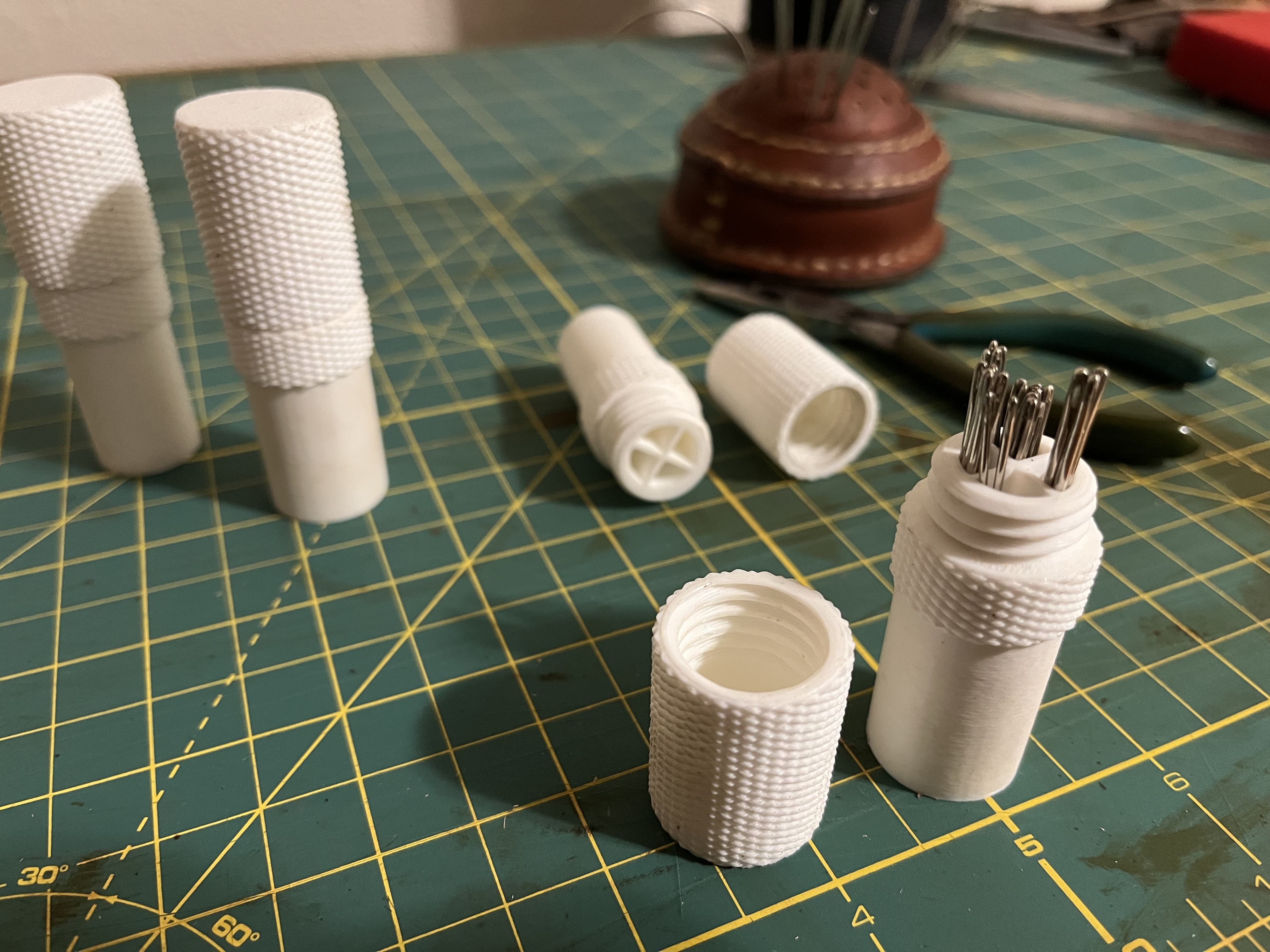 Segmented needle container