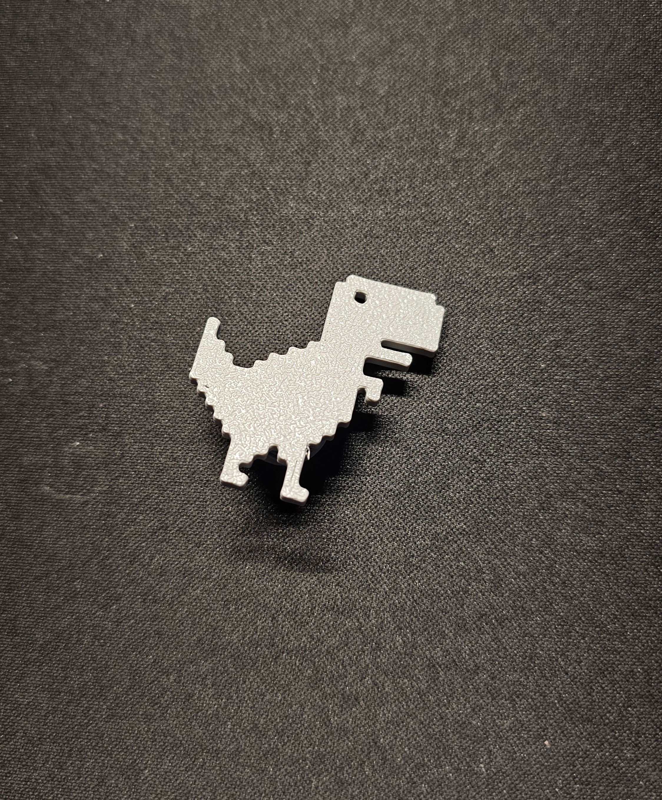 Jibbitz Dinosaurio de Chrome