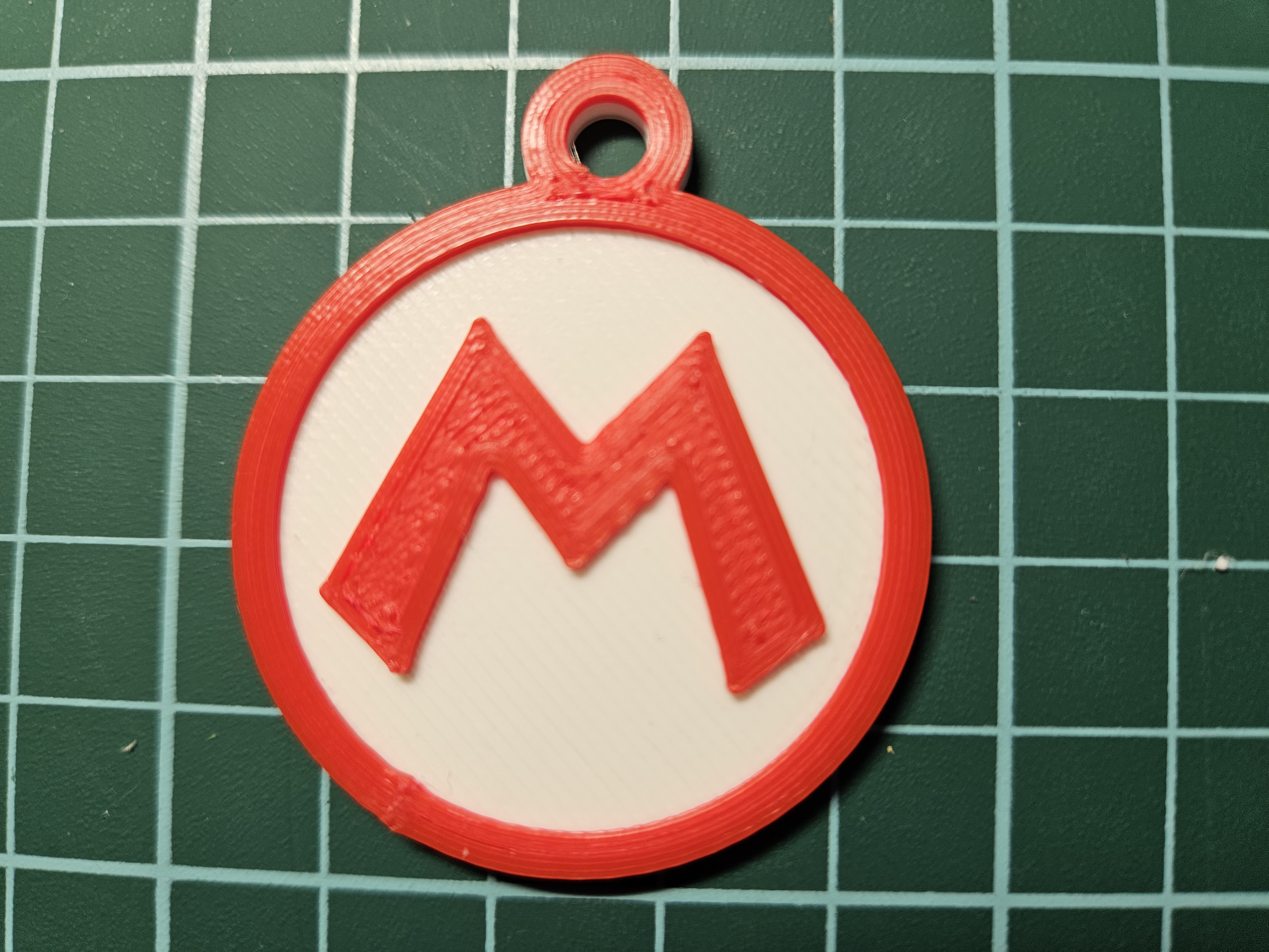 Llavero Logo M Mario Bros