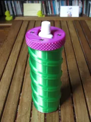 Geared toothpaste tube squeezer