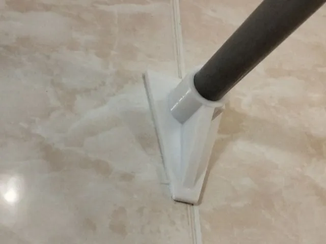 SHOWER CURTAIN HOLDER