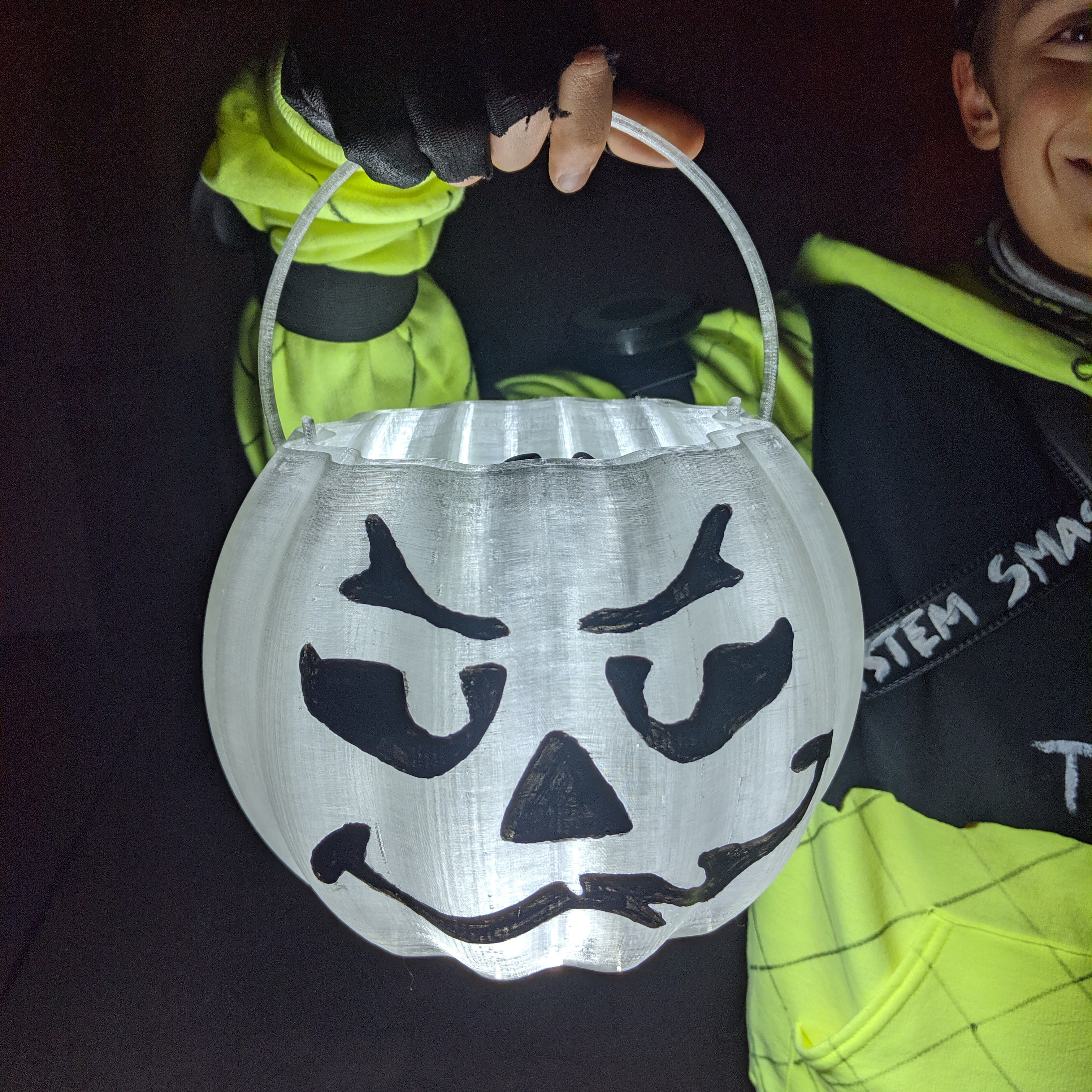 Lighted jack-o-lantern pumpkin candy pale.  Safe and fun!