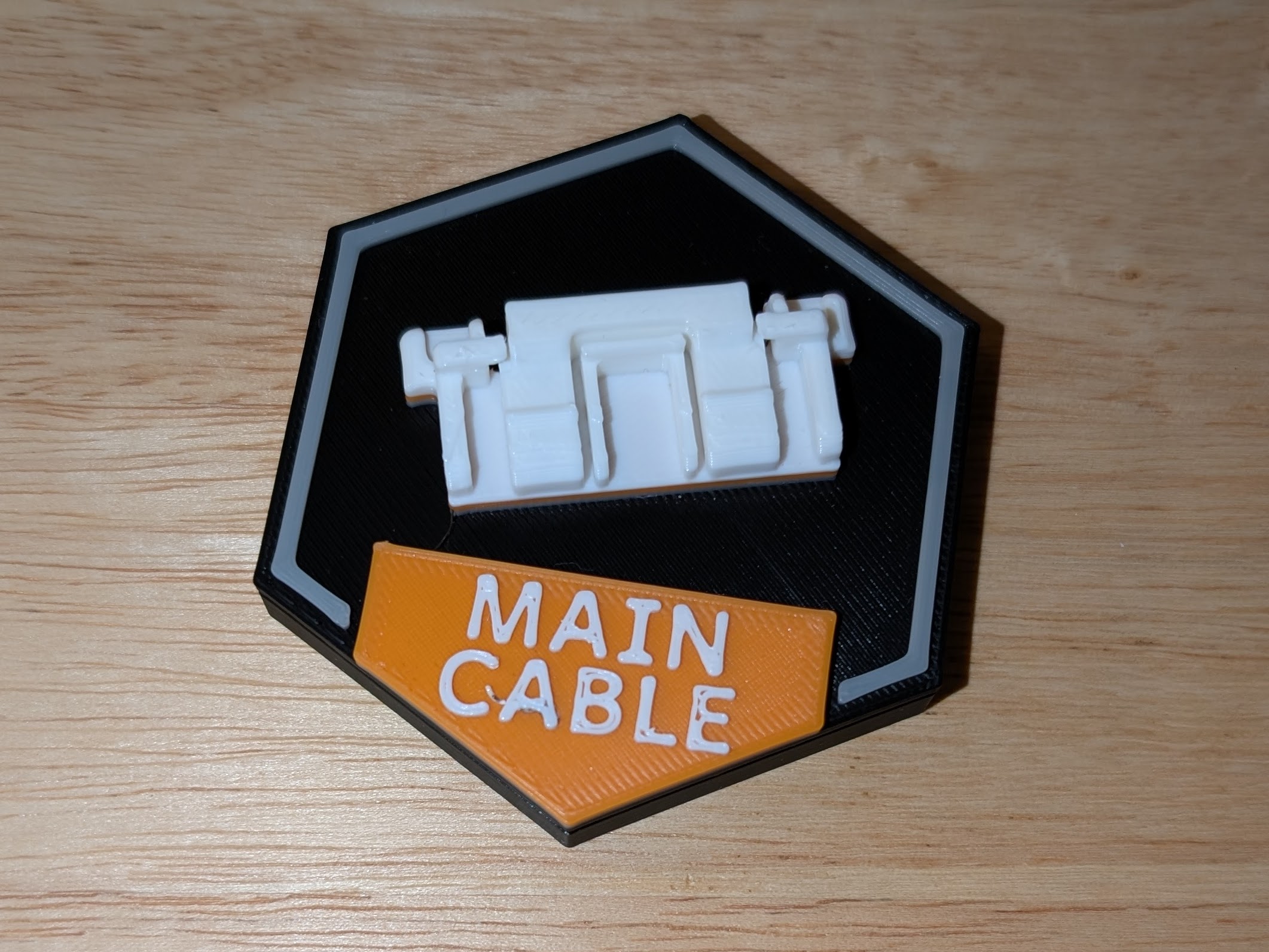 Commemorative badge for replacing Core ONE main cable — missing instructions included
