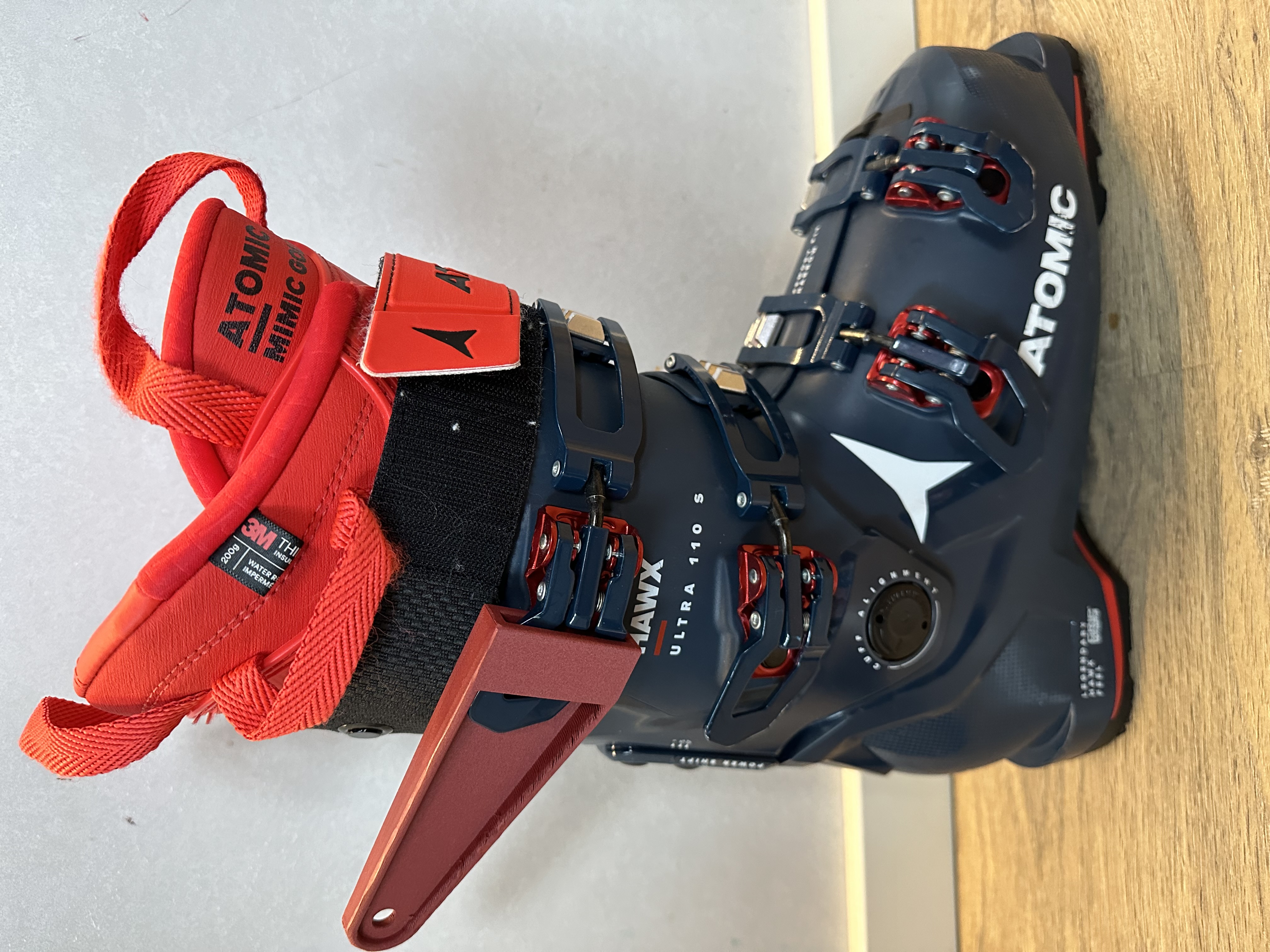 Ski boot tensioner