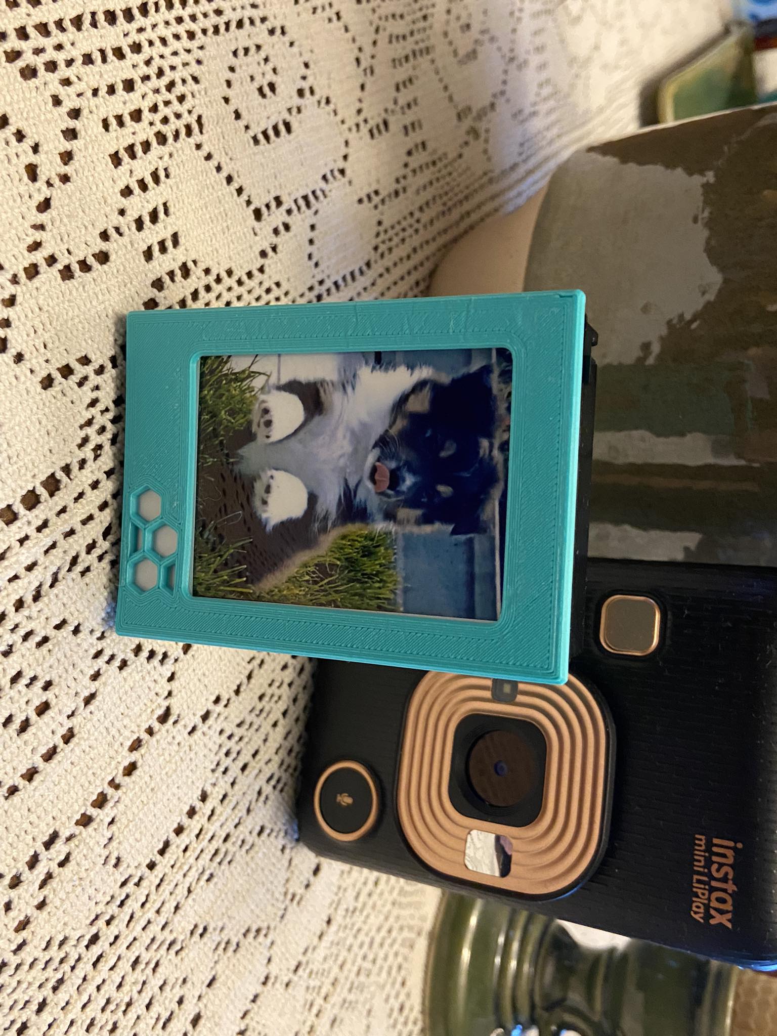 ReFrame - spent Instax mini cartridge recycled into photo frame and storage