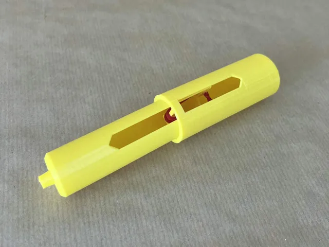 Toilet paper spindle expanding with Rubber Band