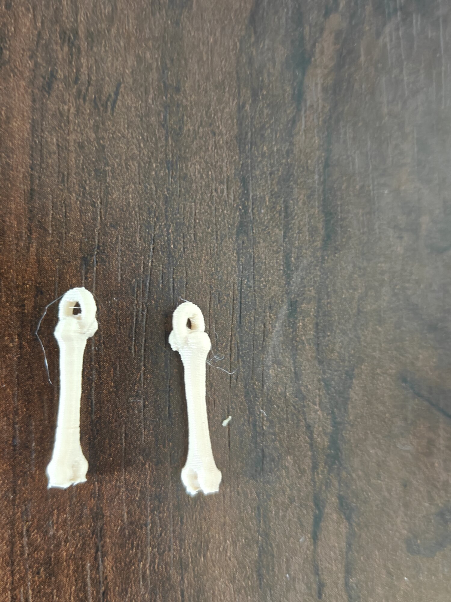 Dino Femur Bone Earring Charm — Mirrored Pair