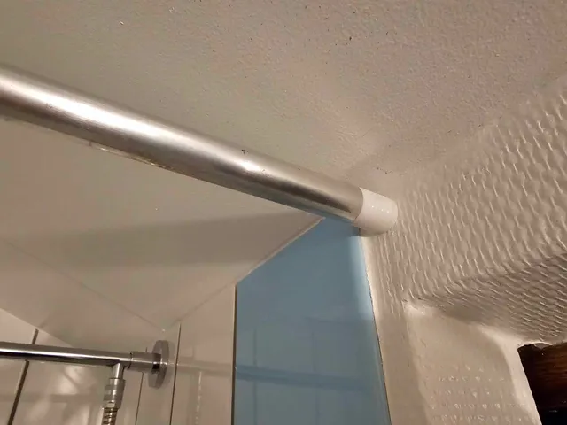 Descreete pipe holder for curtain
