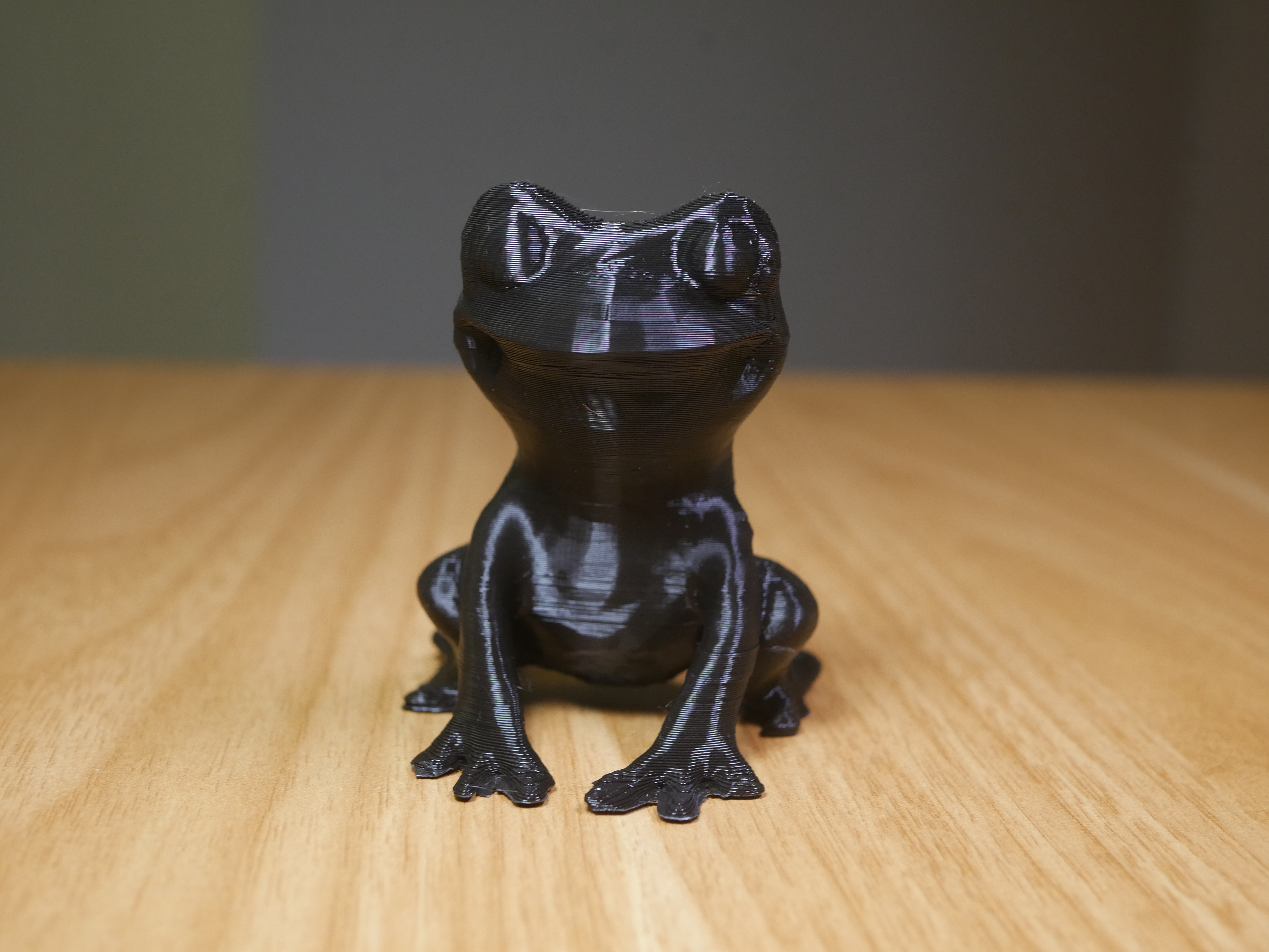 Cute frog sitting figure
