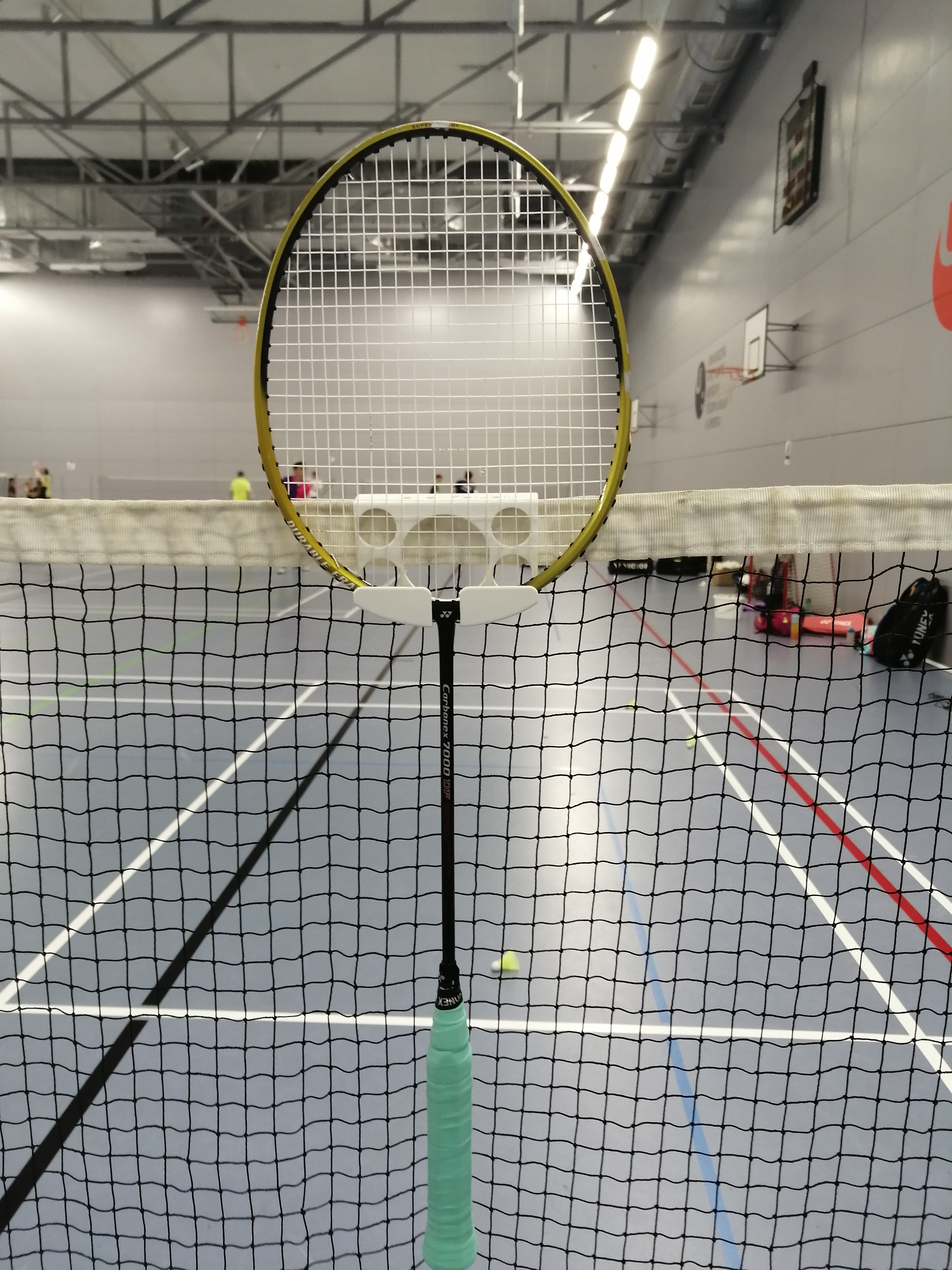 badminton racket holder for net