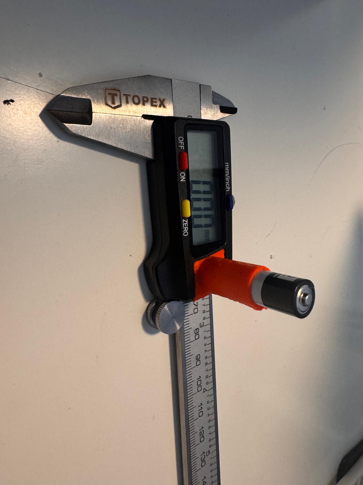 Angled caliper lid with added slot for AAA battery