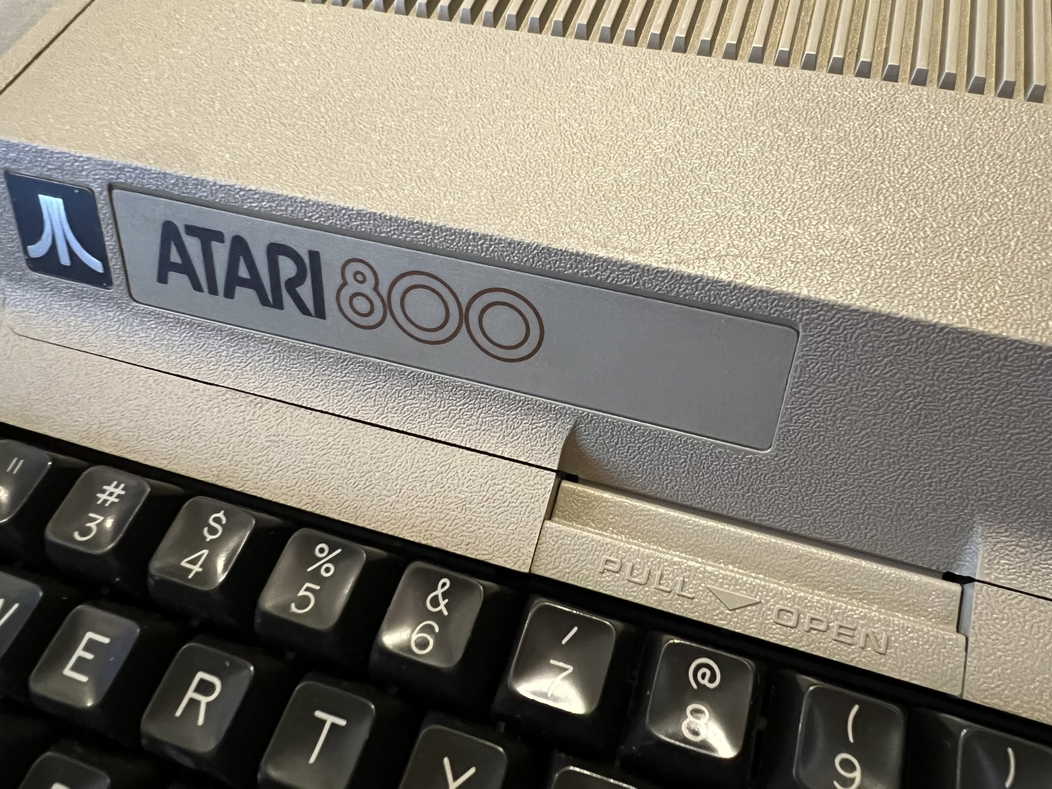 Atari 800 cartridge door latch spring retainer