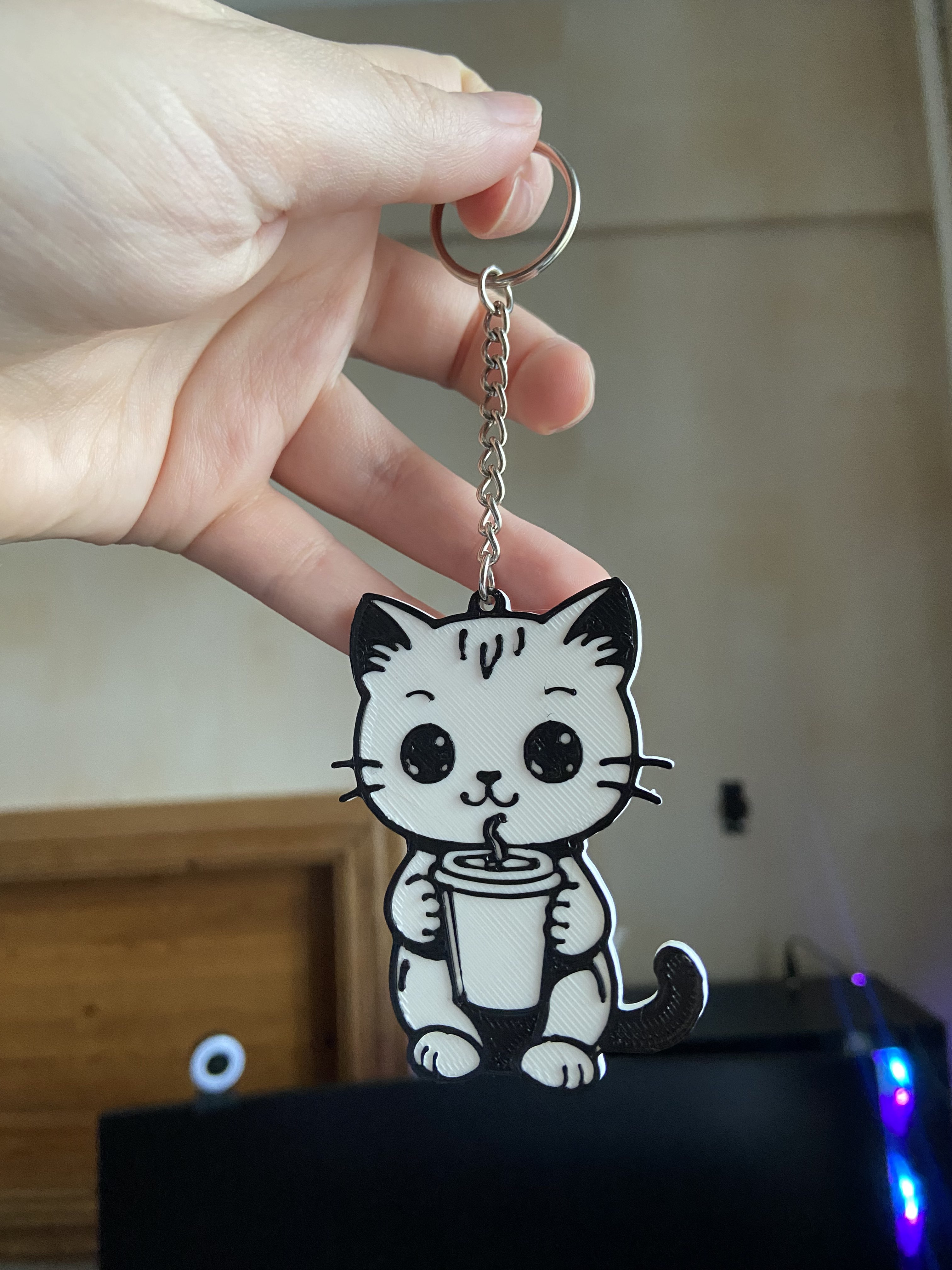 Cute cat holding coffee cup keychain