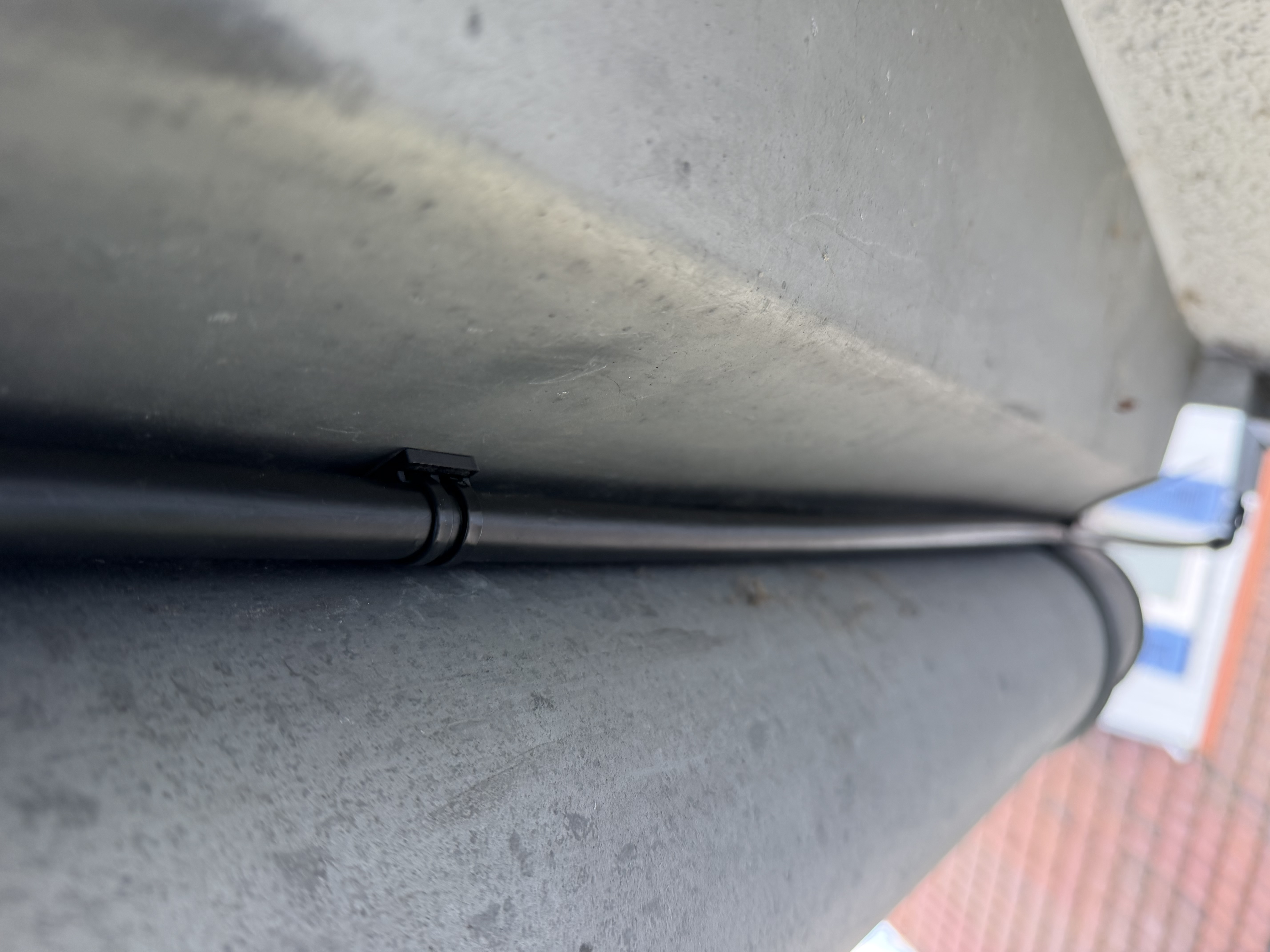 Gardena microdrip 13mm tube holder using double-sided adhesive tape and zipties