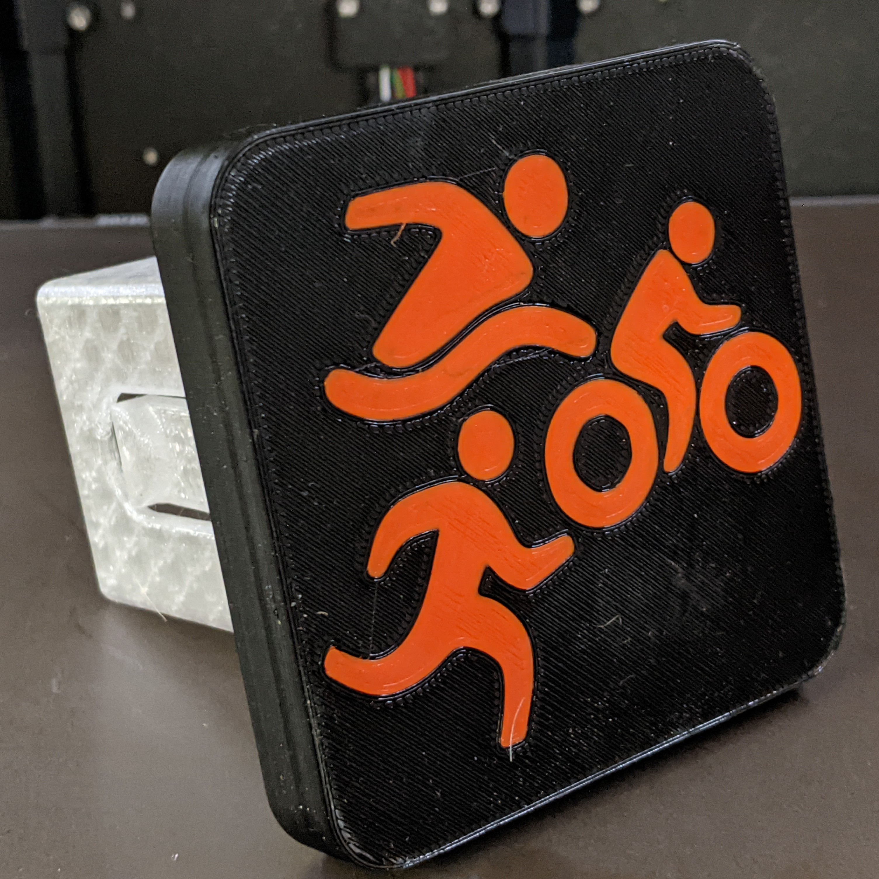 Triathlon Trailer hitch mount cover by Maturity Download free STL model