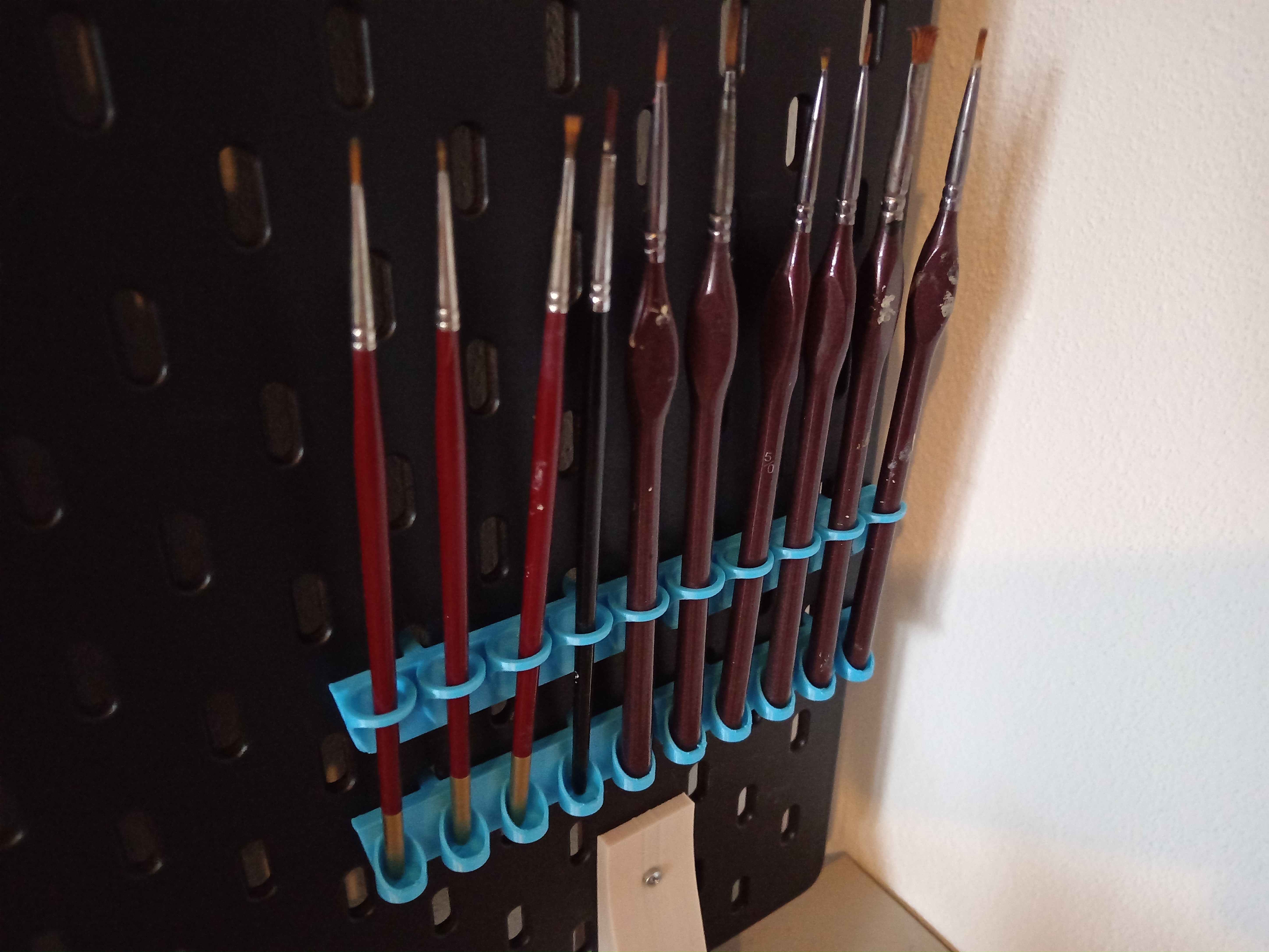 Skadis paintbrush holder