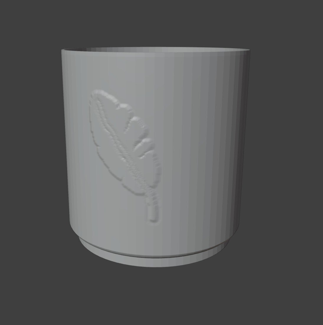 A planter with a leaf