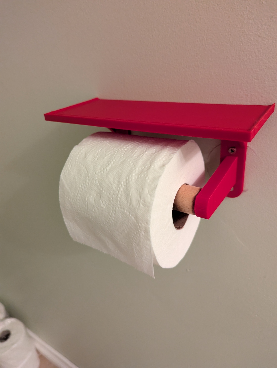 Toilet paper holder with shelf