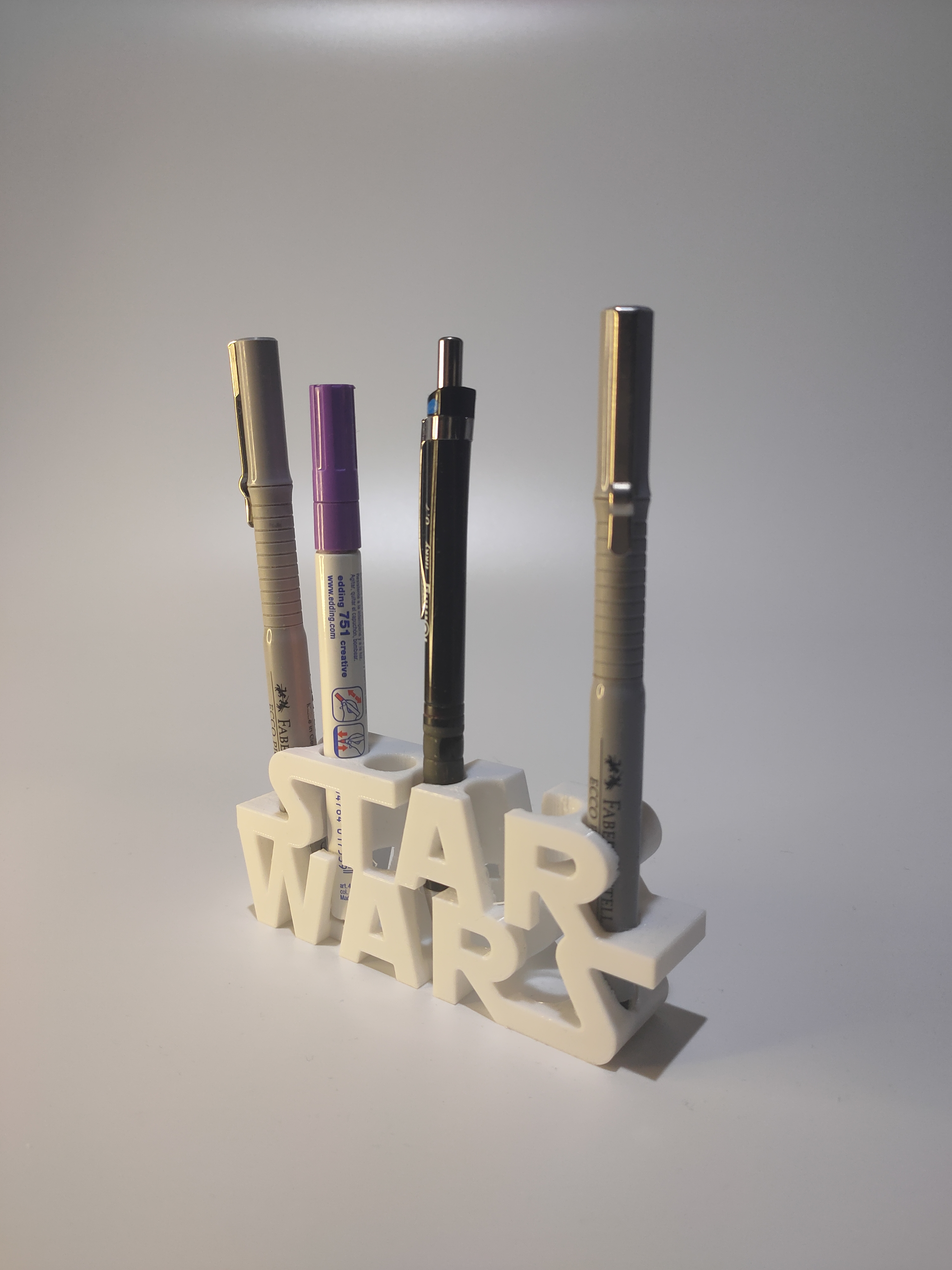 Pencil holder with superhero logos