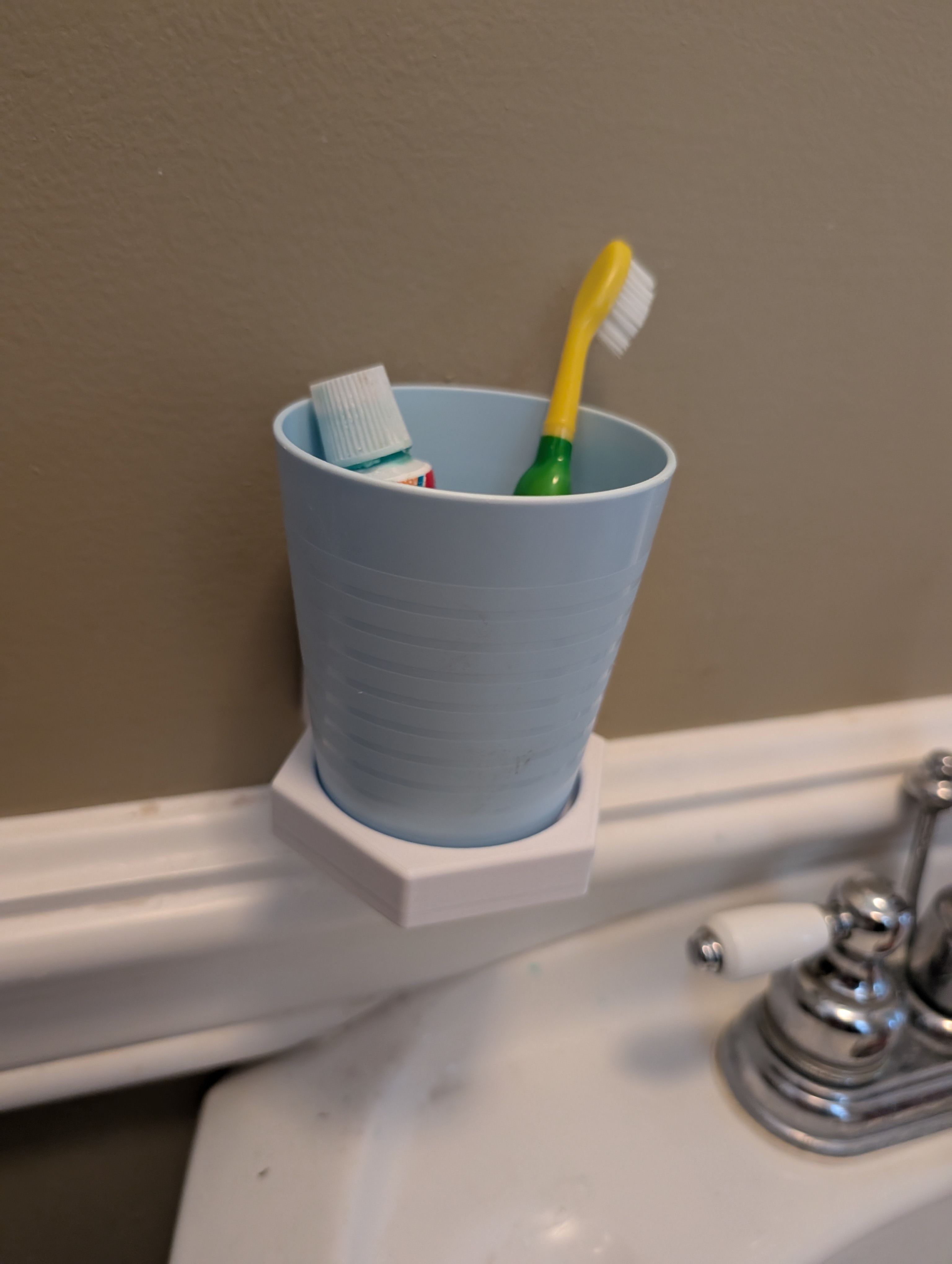 Small wall mounted cup holder