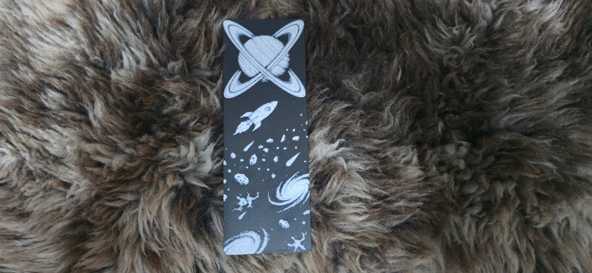 Intertwined Rings Planet and Rocket Bookmark