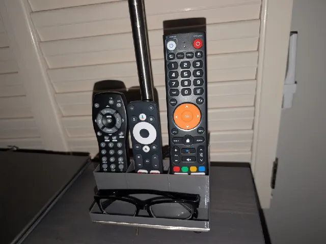 remote and glasses holder that sticks on night stand light from IKEA