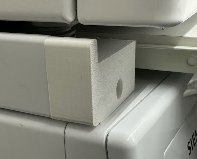 Stopper block for stacking a (European) Miele tumble dryer on top of a Siemens washing machine