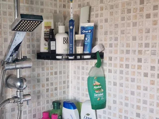 Shower corner shelf