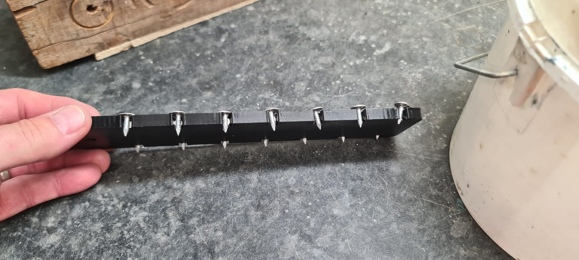 Clout Nail holder and guide.