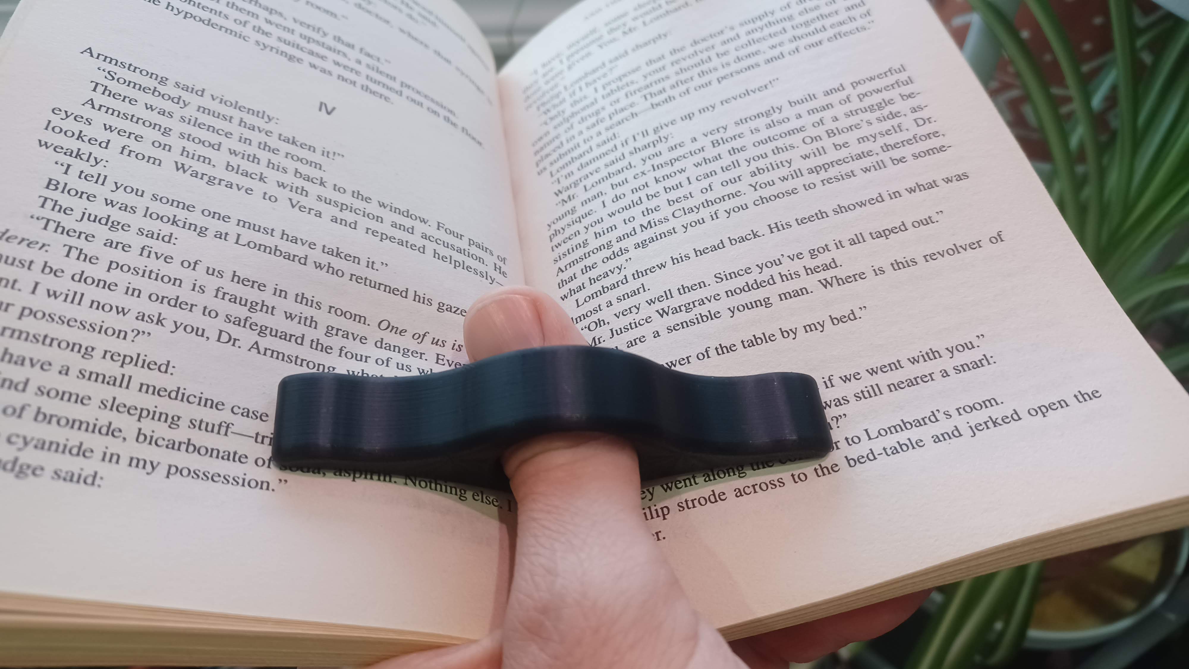 Book page holder thumb ring