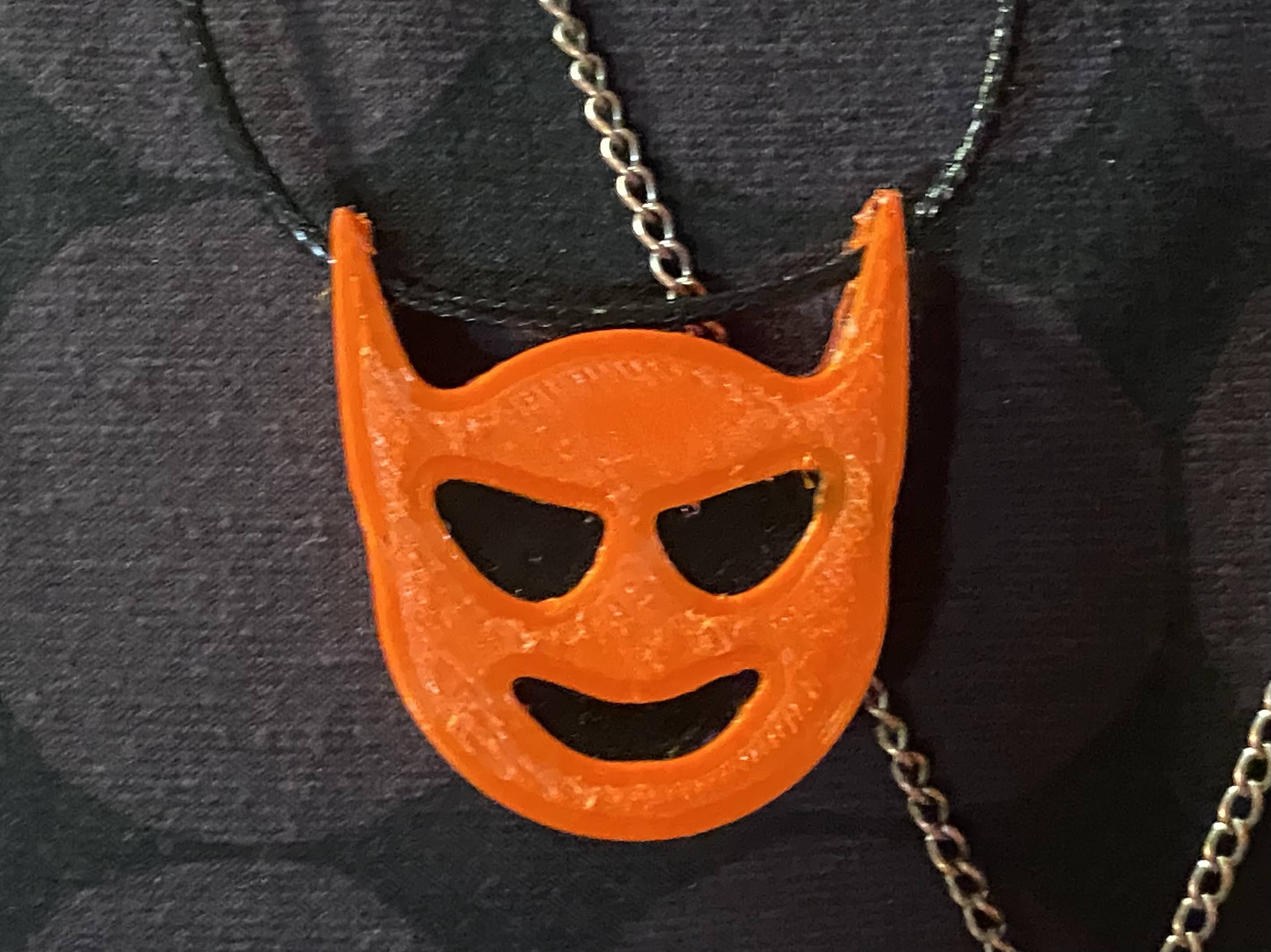 Devil's head and Trident pendants