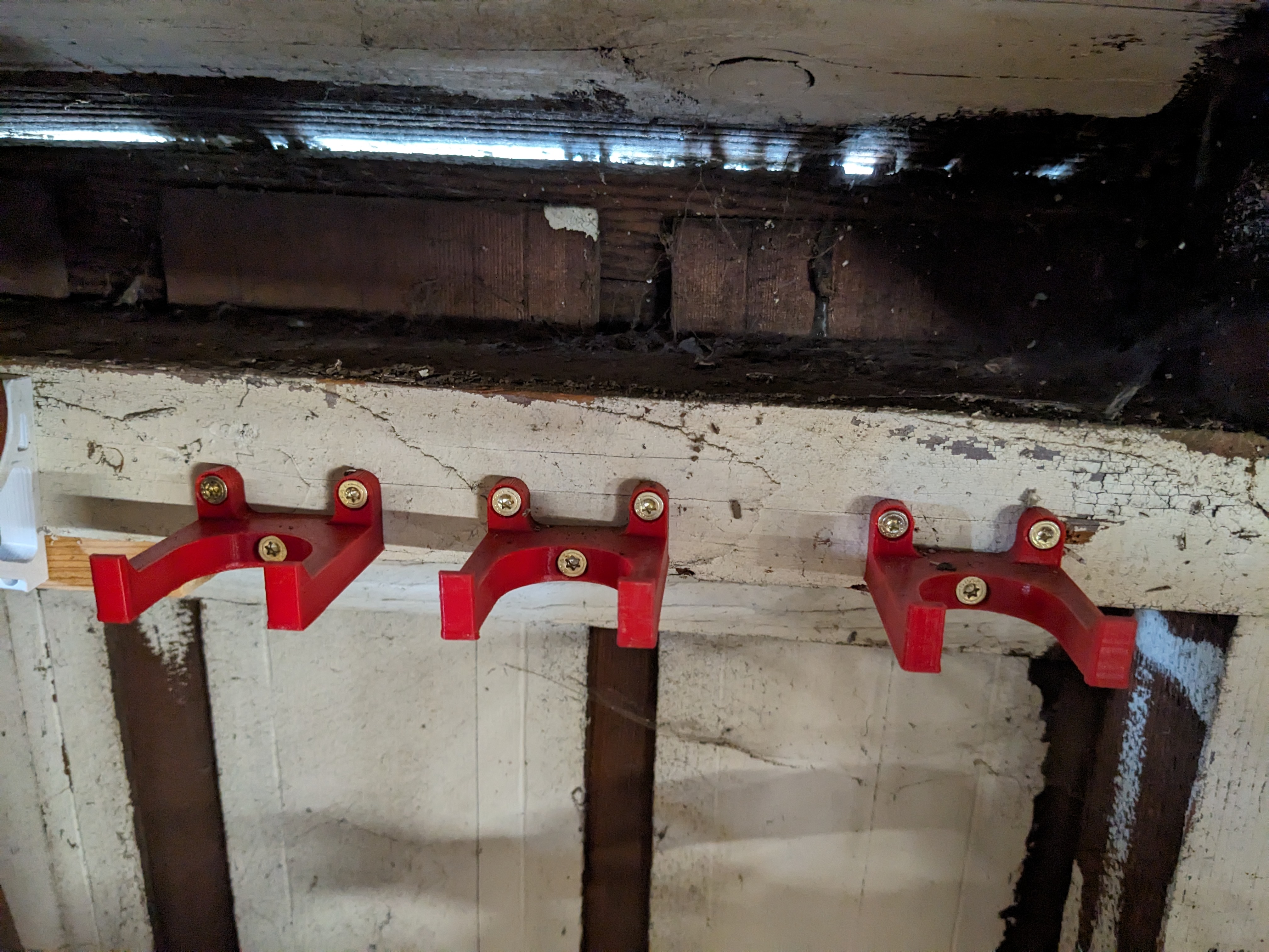 Garden tool holder wall mount (specific for Dewalt Pole Chainsaw)