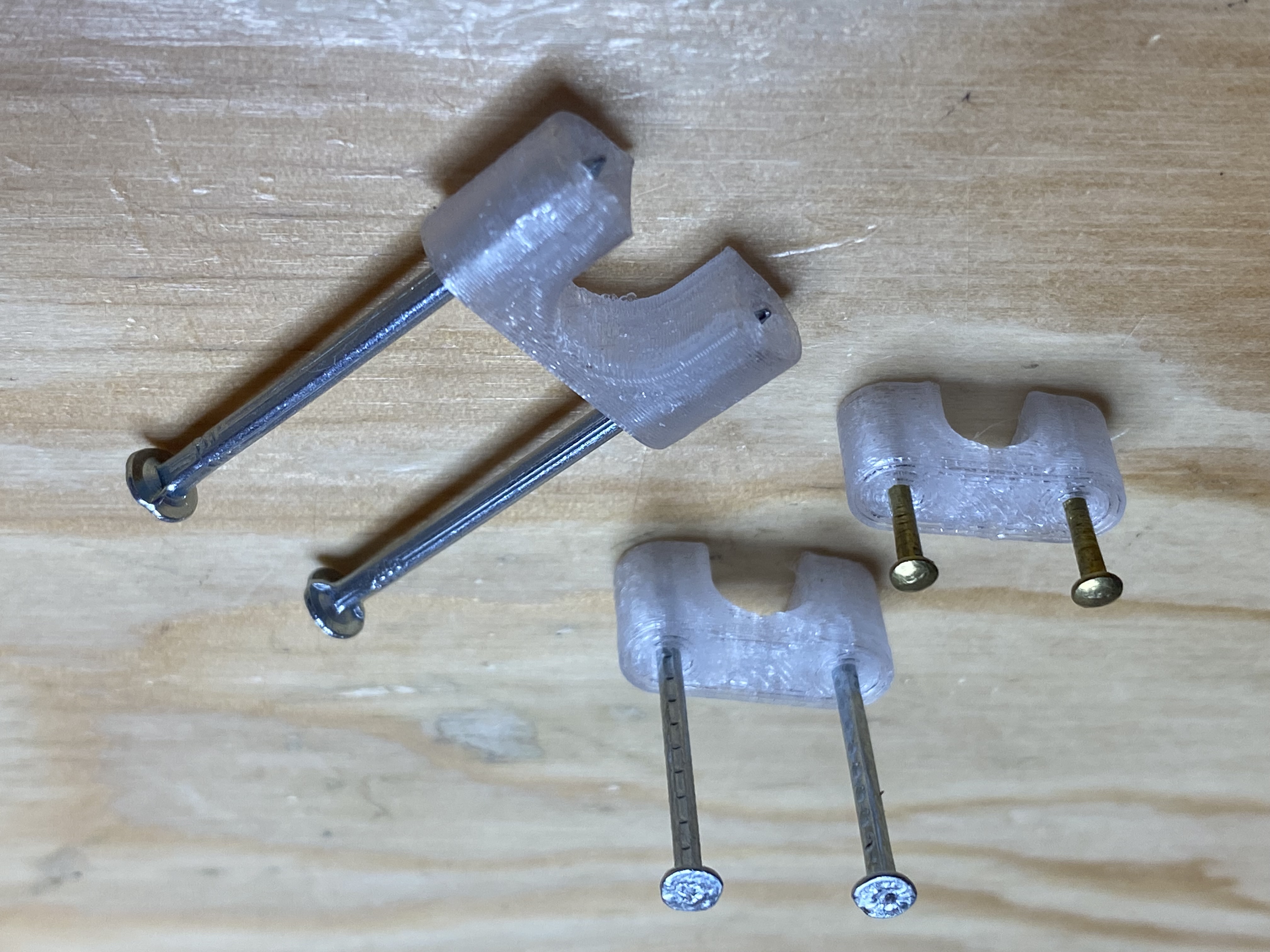 Double nail cable clip