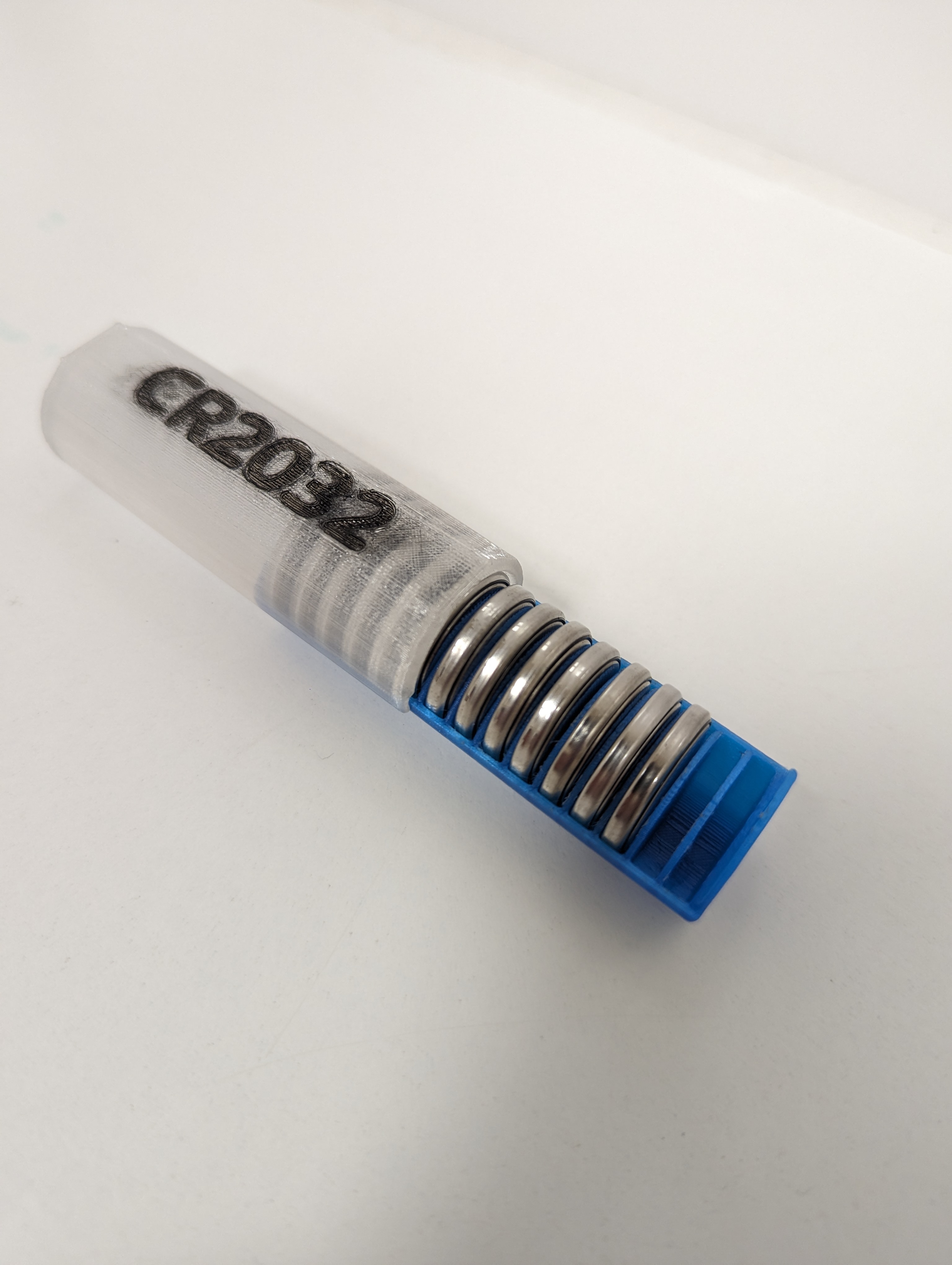 CR2032 battery compact holder with magnet lock
