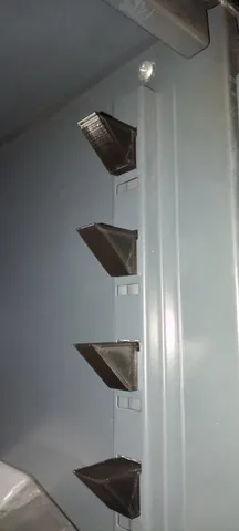 Metal cabinet shelf support