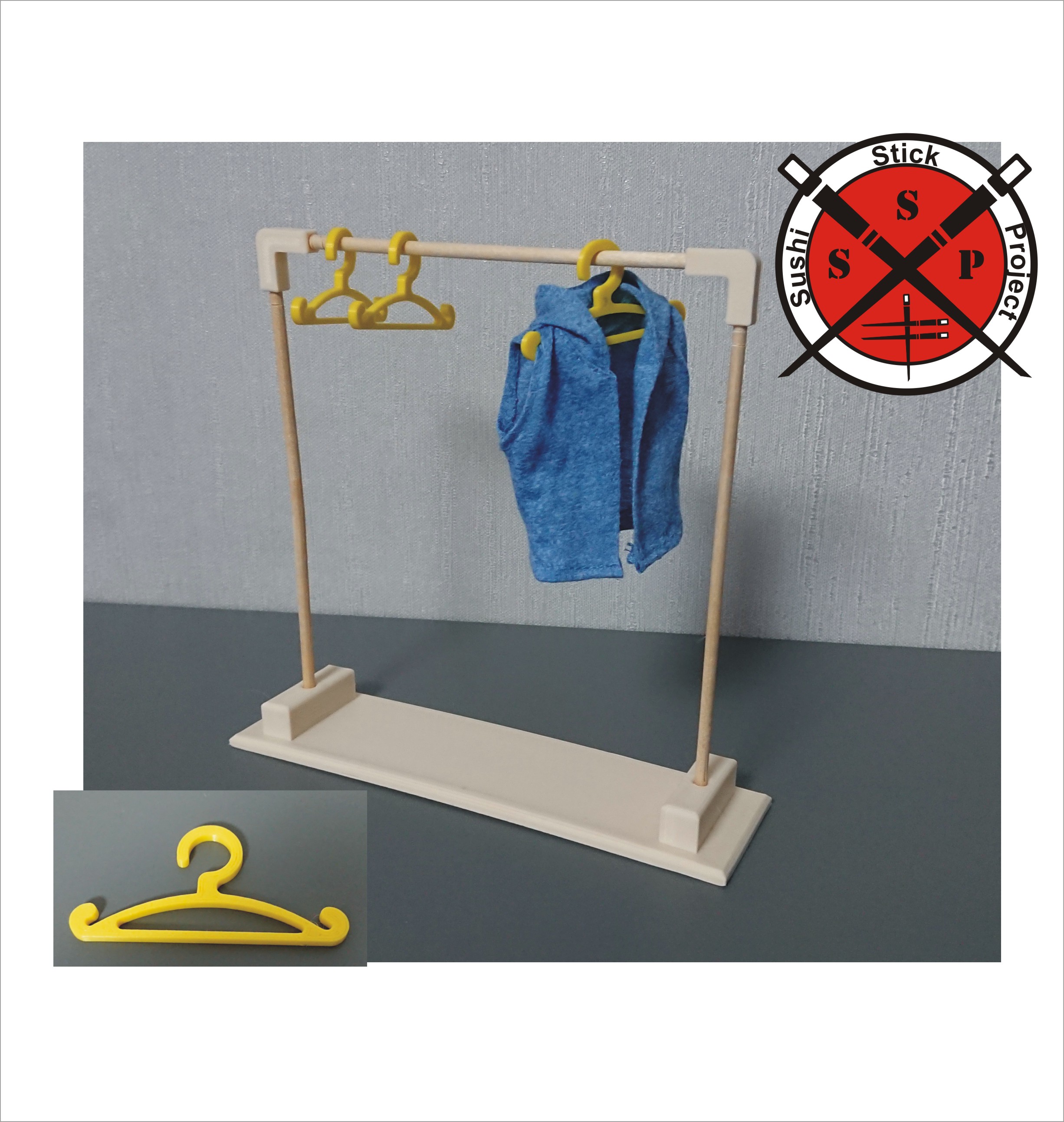 A hanger for doll clothes. SSP.