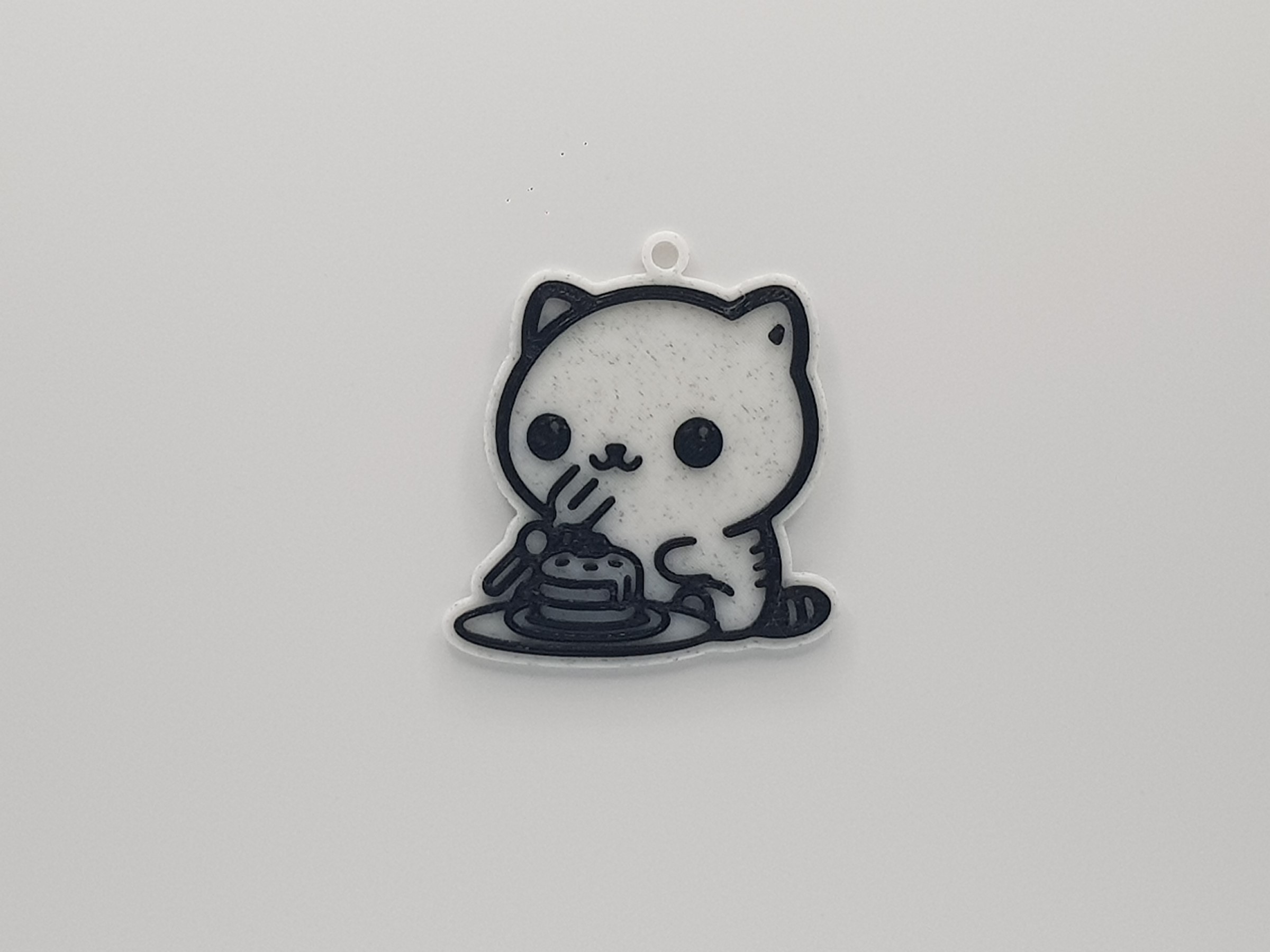 Cute Cat Eating a Cake Keychain