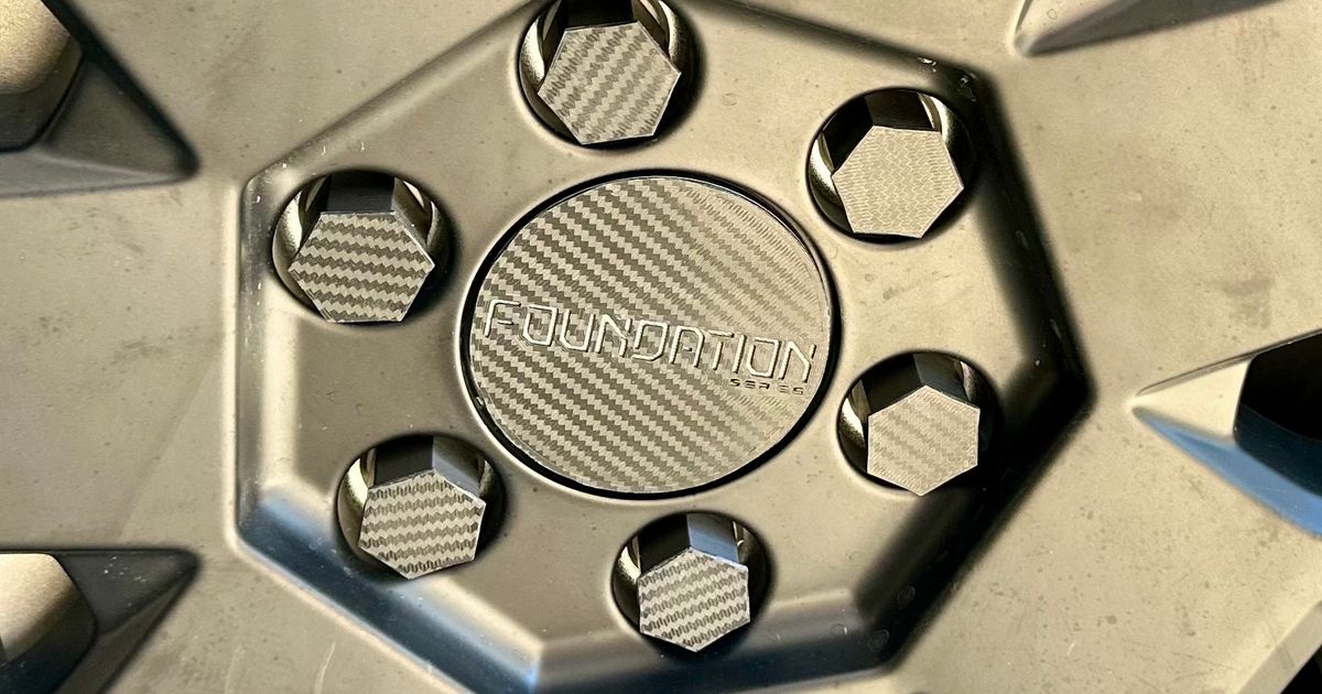 cybertruck wheel center caps with 4 different logos and lug nut covers
