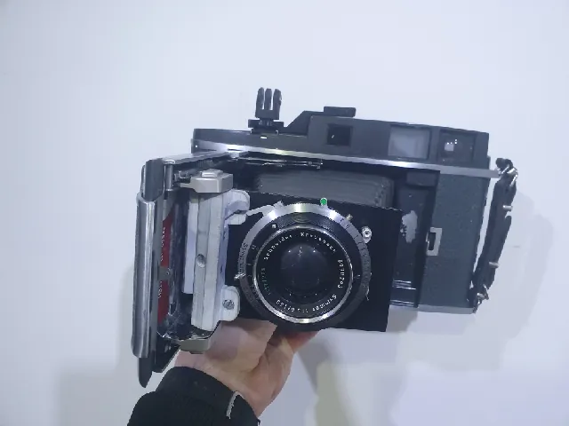Front standard for a Polaroid 900 camera with trigger.