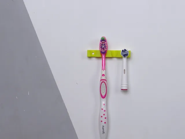 Toothbrush wall holder/hanger