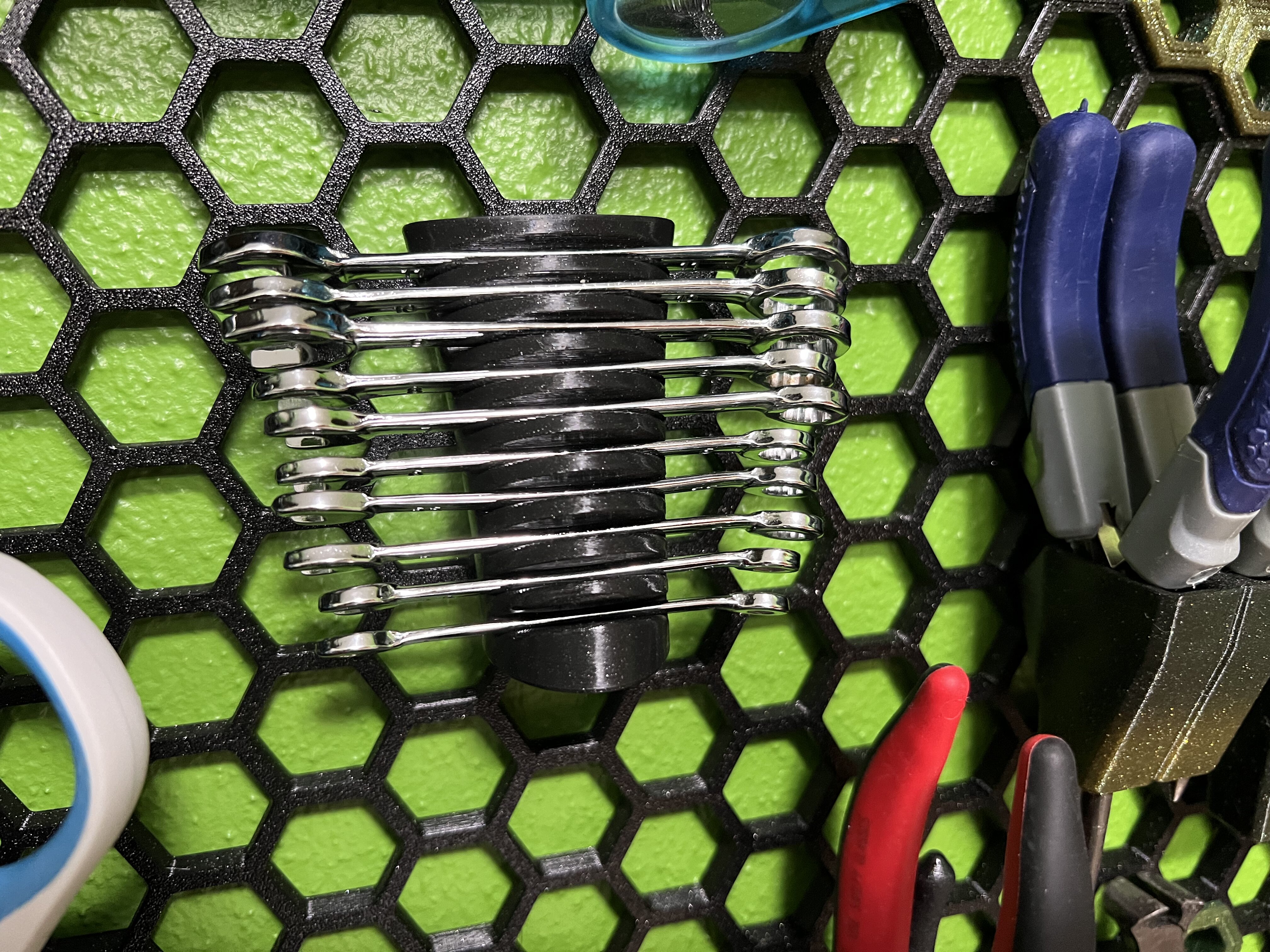 Mini wrench holder for honeycomb storage wall