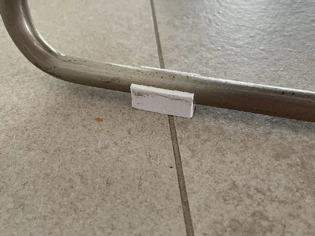 Chair skid clip on round metal bar