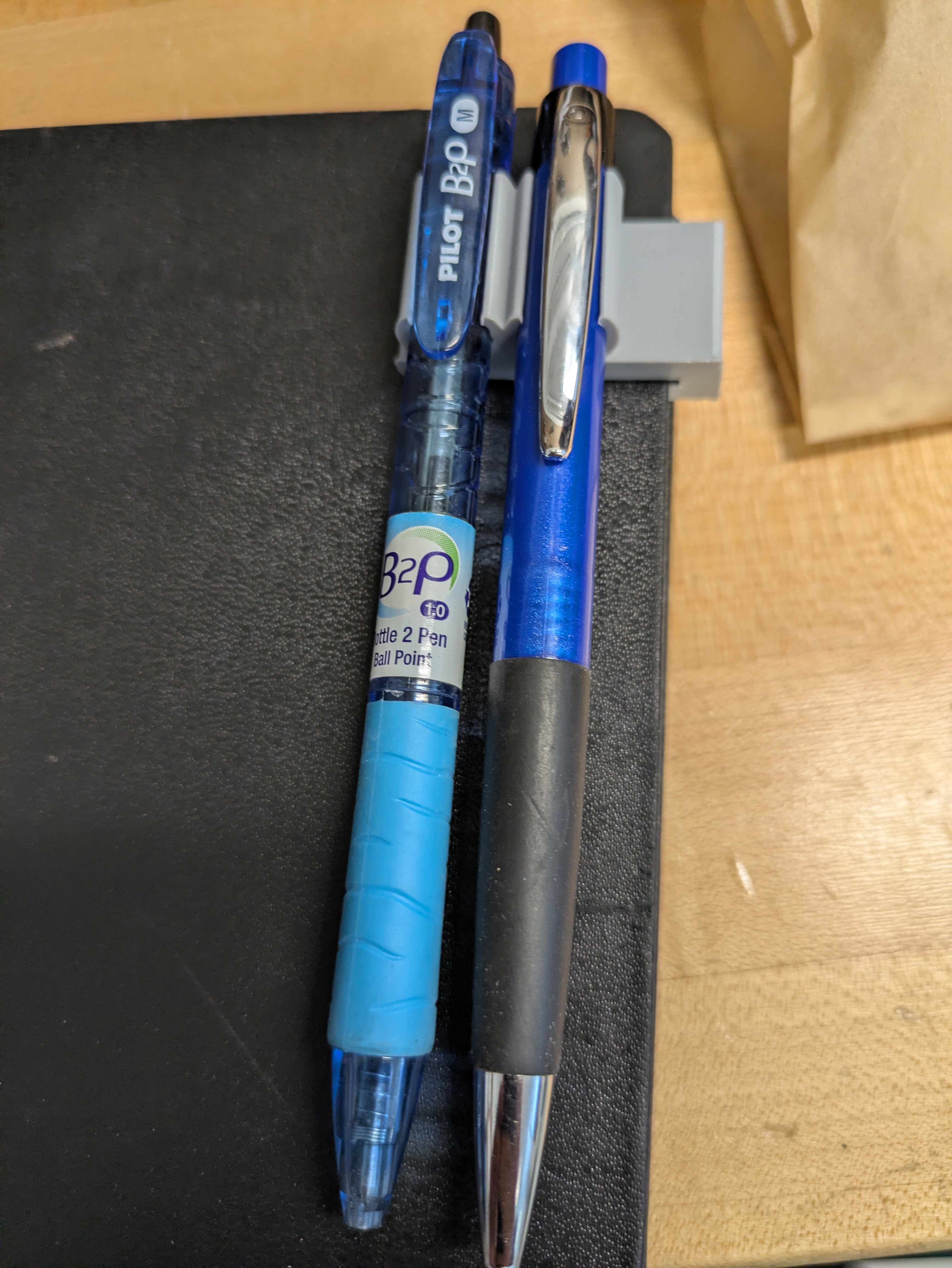 Tighter notebook pen clip