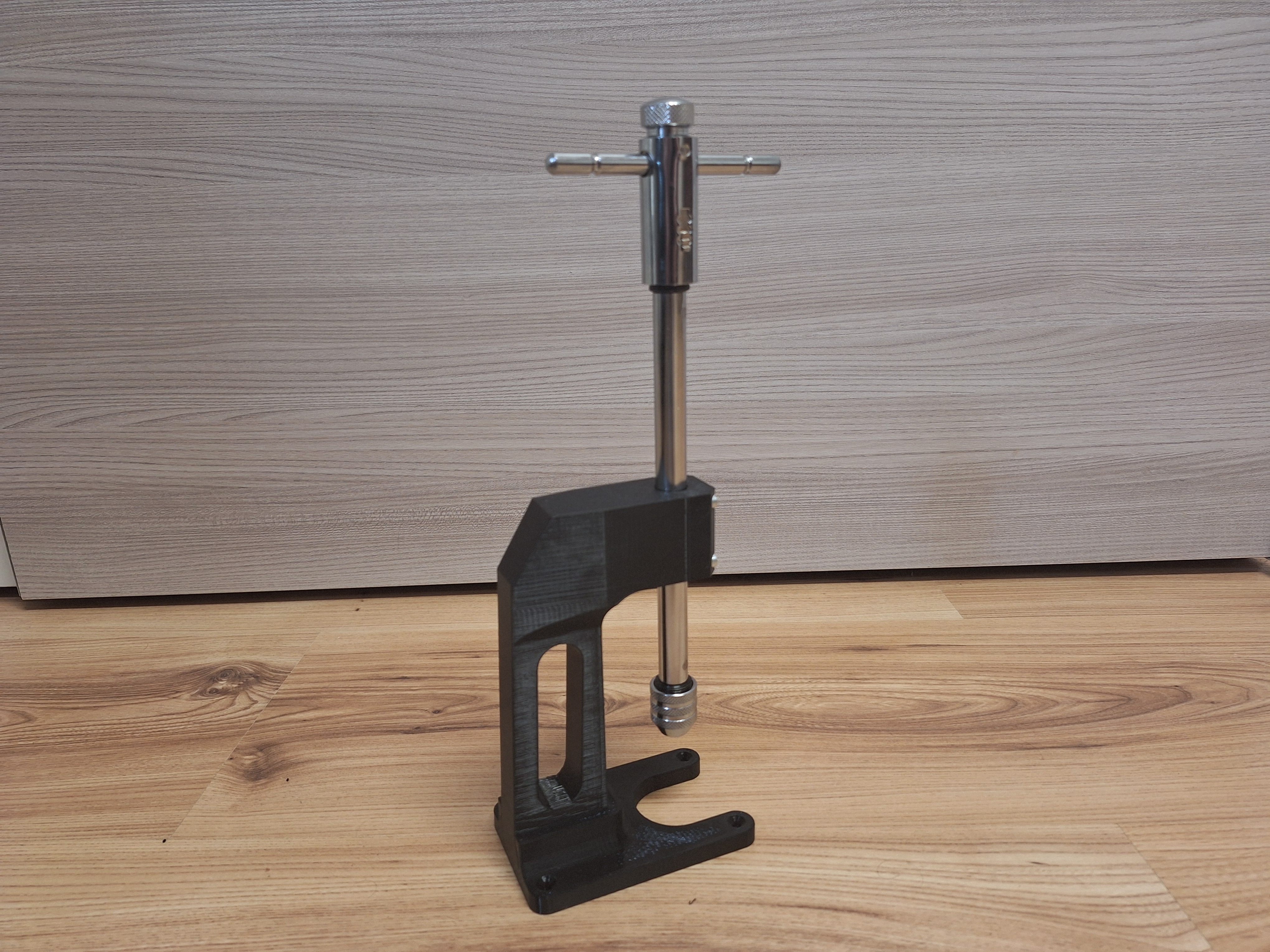Tapping Arm